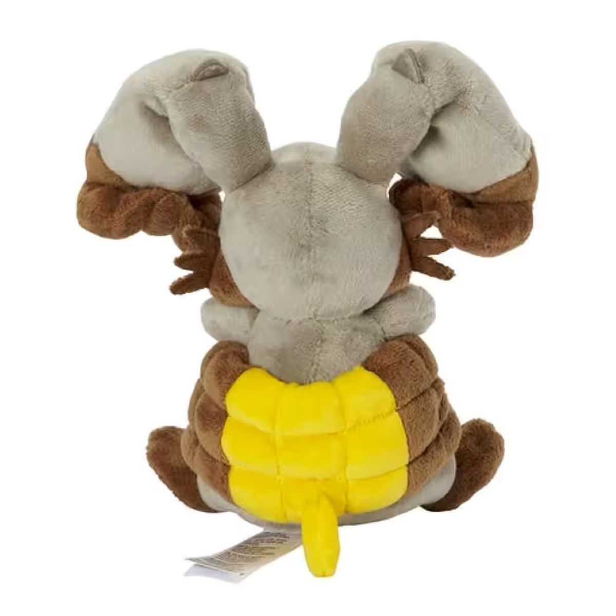 Ein Stofftier in Form eines Pokémon. Es hat hellbraune Ohren, einen braunen Körper und einen gelben Bauch. Ein Etikett ist befestigt.