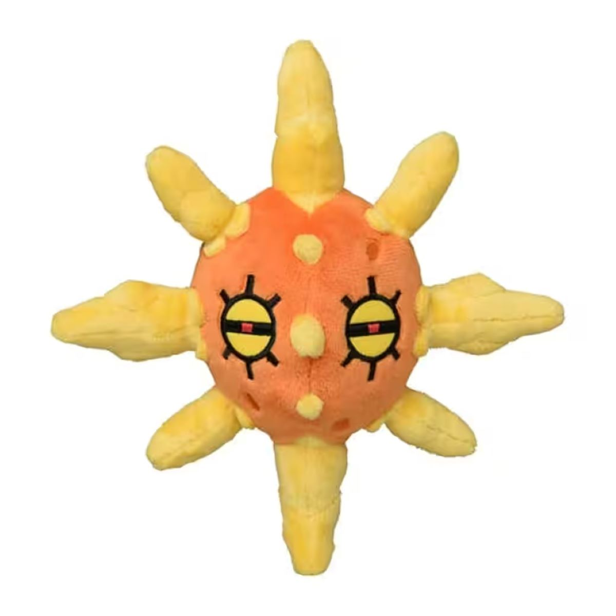 Ein Plüsch-Solrock-Spielzeug. Es ist orange mit gelben Sonnenstrahlen. Es hat schwarze Augen, einen lächelnden Mund und weiße Flecken. Es ist isoliert auf Weiß.