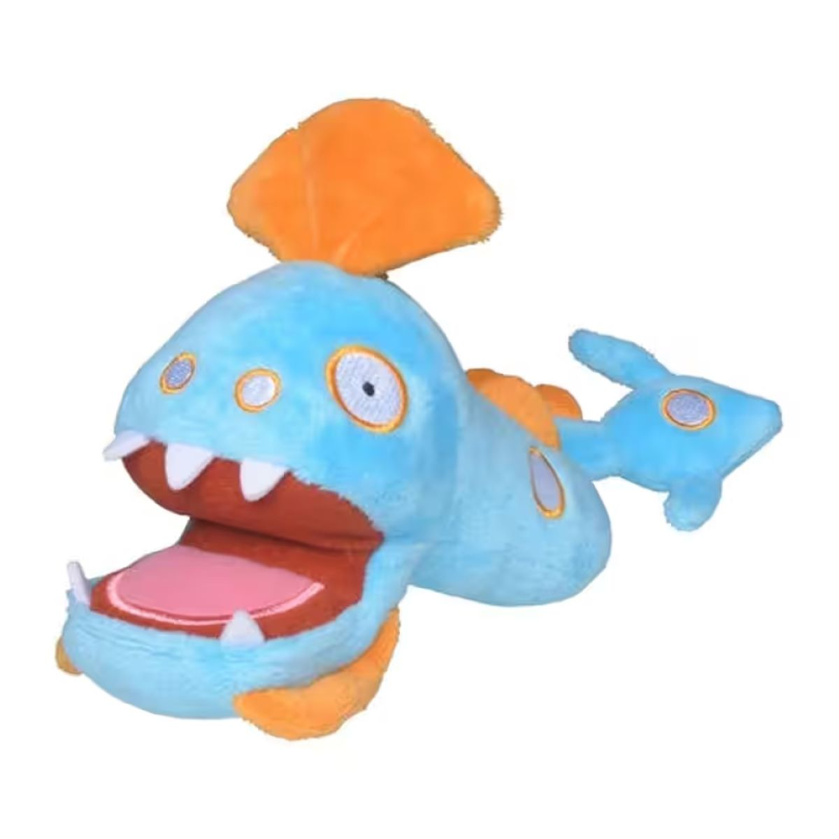 Ein Plüschfisch mit hellblauem Körper, orangefarbenen Flossen und Kopfschmuck sowie einem großen offenen Maul mit scharfen Zähnen.