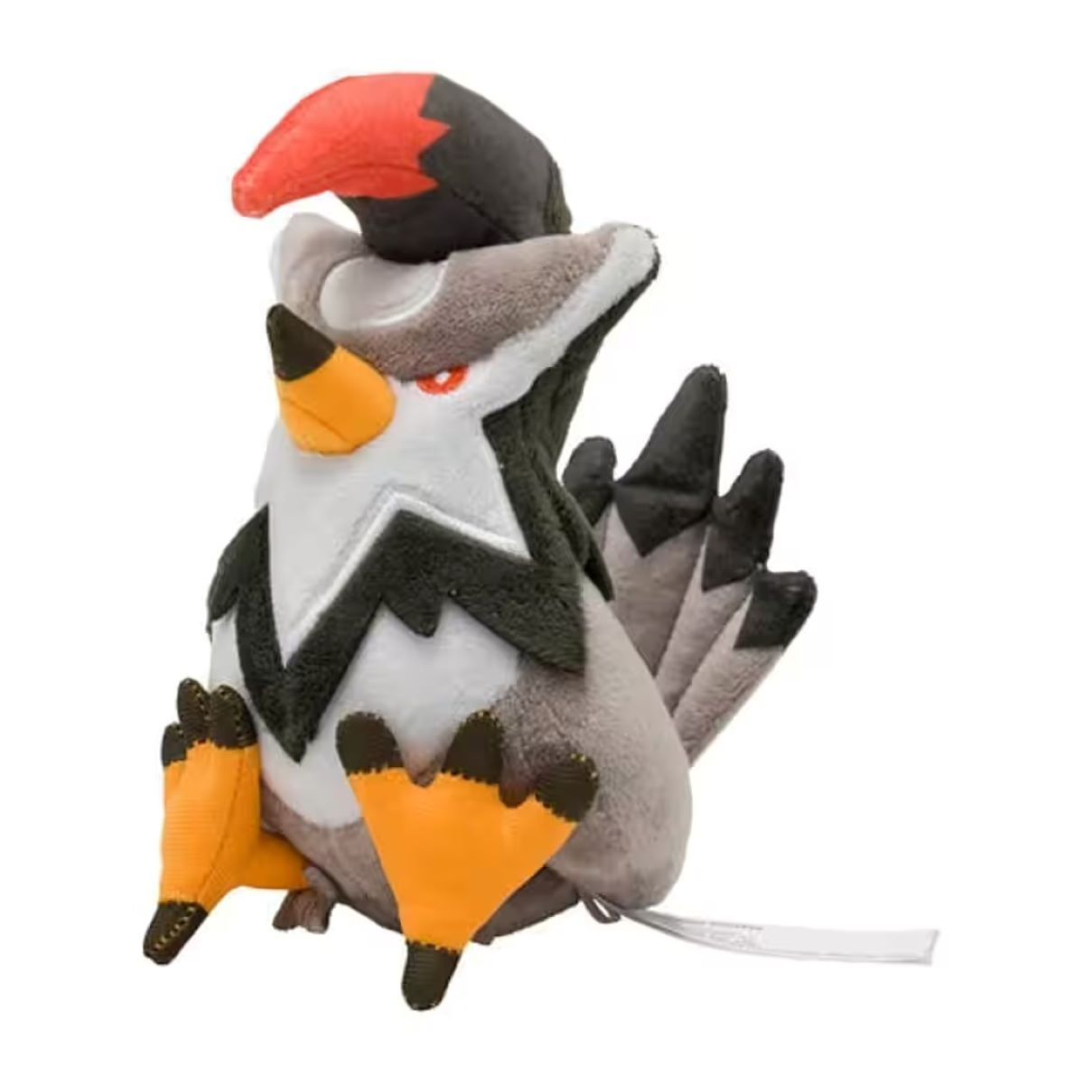 Ein Plüschvogelspielzeug. Das Spielzeug ist weiß, grau, schwarz, orange und rot. Es hat einen roten Schnabel und orange Füße. Es ist auf weißem Hintergrund.