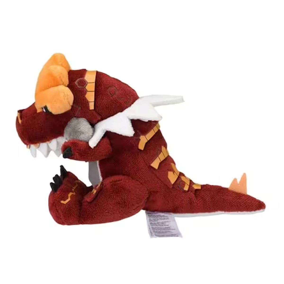Ein plüschiger roter Drache mit orangefarbenen Hörnern und gelben Akzenten. Er hat weiße Zähne und Flügel. Der Drache befindet sich auf weißem Hintergrund.