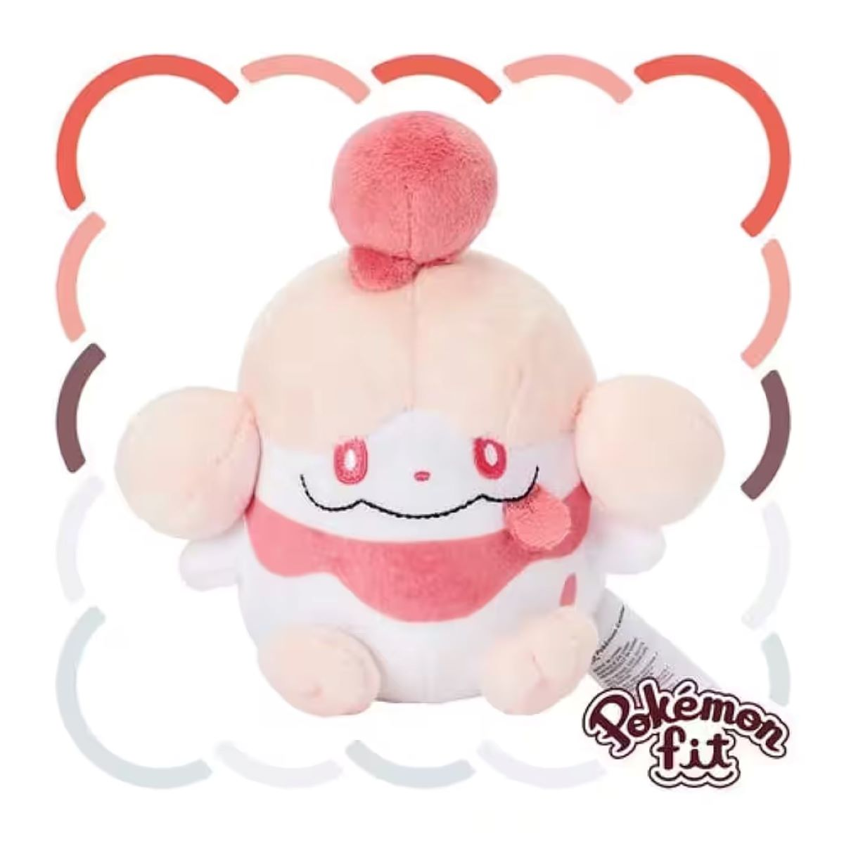 Ein Plüschtier in Form eines cremefarbenen Desserts mit rosa Streifen, Augen und einem kleinen Ball oben. Pokémon Fit Logo sichtbar.