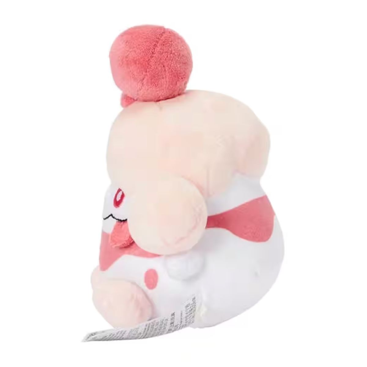 Ein Plüschtier einer Zeichentrickfigur. Es hat einen rosa Kopf, einen weißen Körper mit rosa Streifen und einen rosa Ball oben drauf. Es hat ein Etikett.