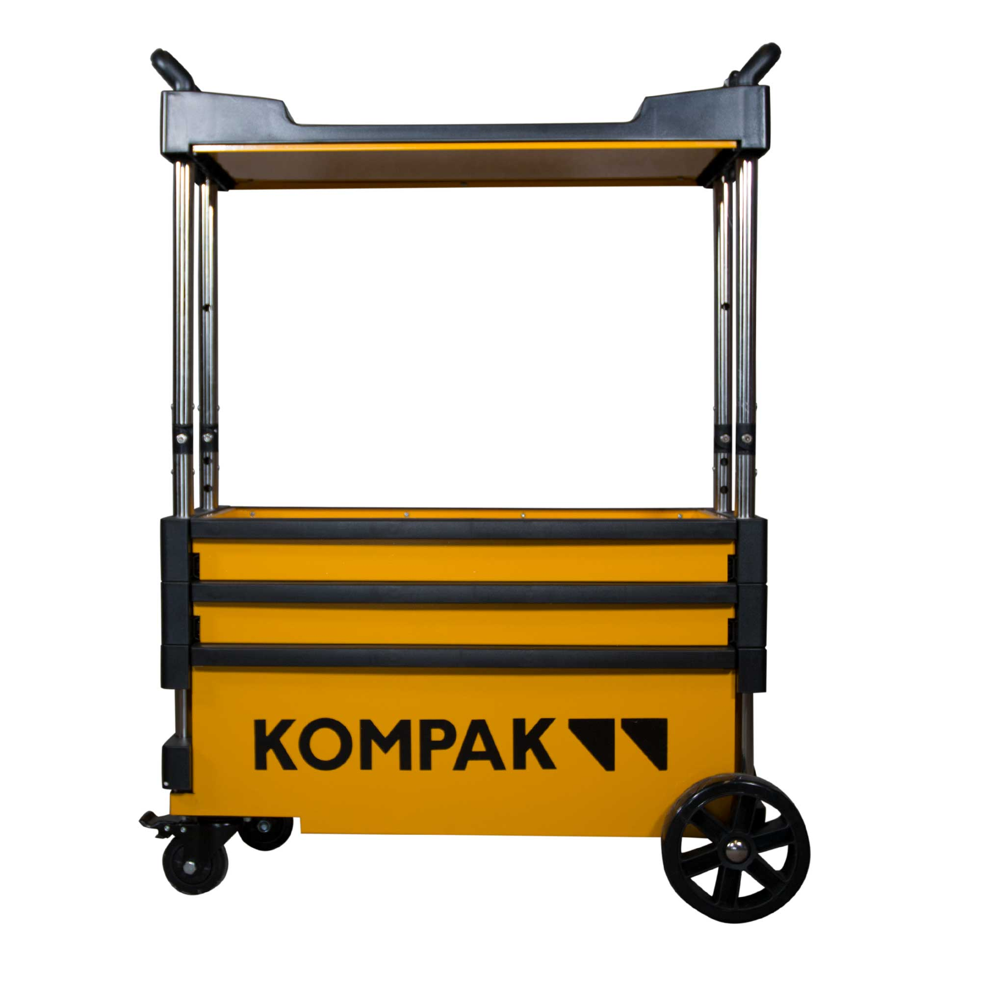 Carro de herramientas amarillo y negro con la palabra KOMPAK. Tiene ruedas y un asa. El fondo es blanco.