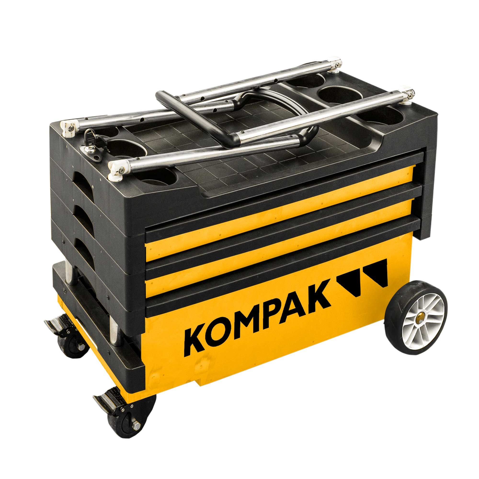 Un carro de herramientas rodante amarillo y negro con la palabra KOMPAK al frente. Tiene ruedas, cajones y un asa.