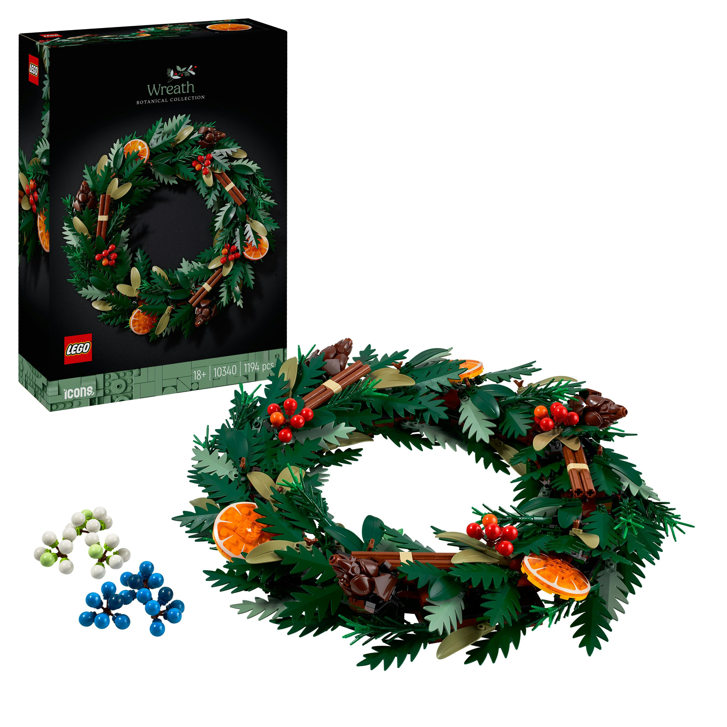 LEGO krans set. Het bevat groene bladeren, sinaasappelschijfjes, rode bessen, kaneelstokjes en een doos met de afbeelding van de set.