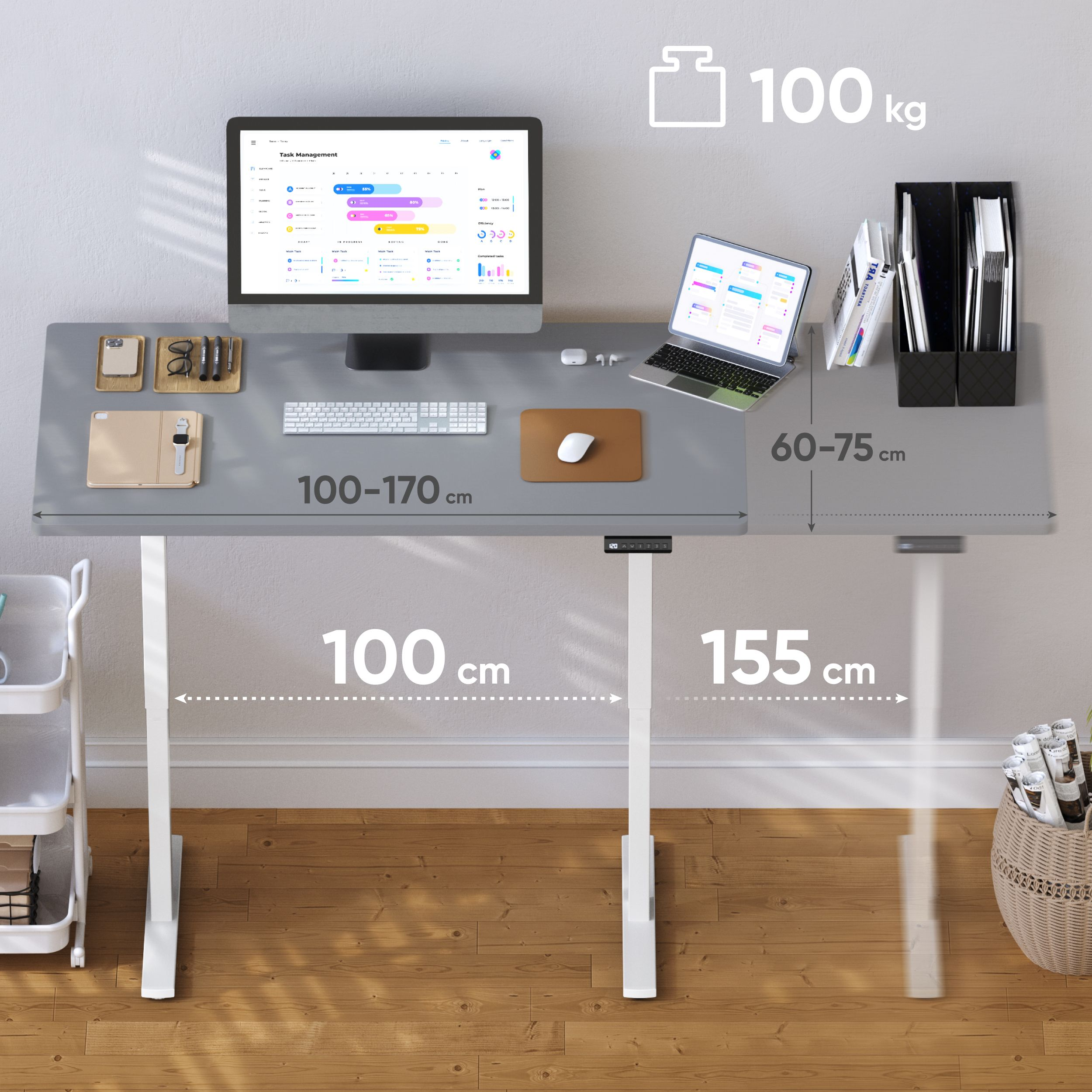 Ein grauer Schreibtisch mit Computer, Laptop und Bürobedarf. Maße und ein Gewicht von 100 kg werden angezeigt.