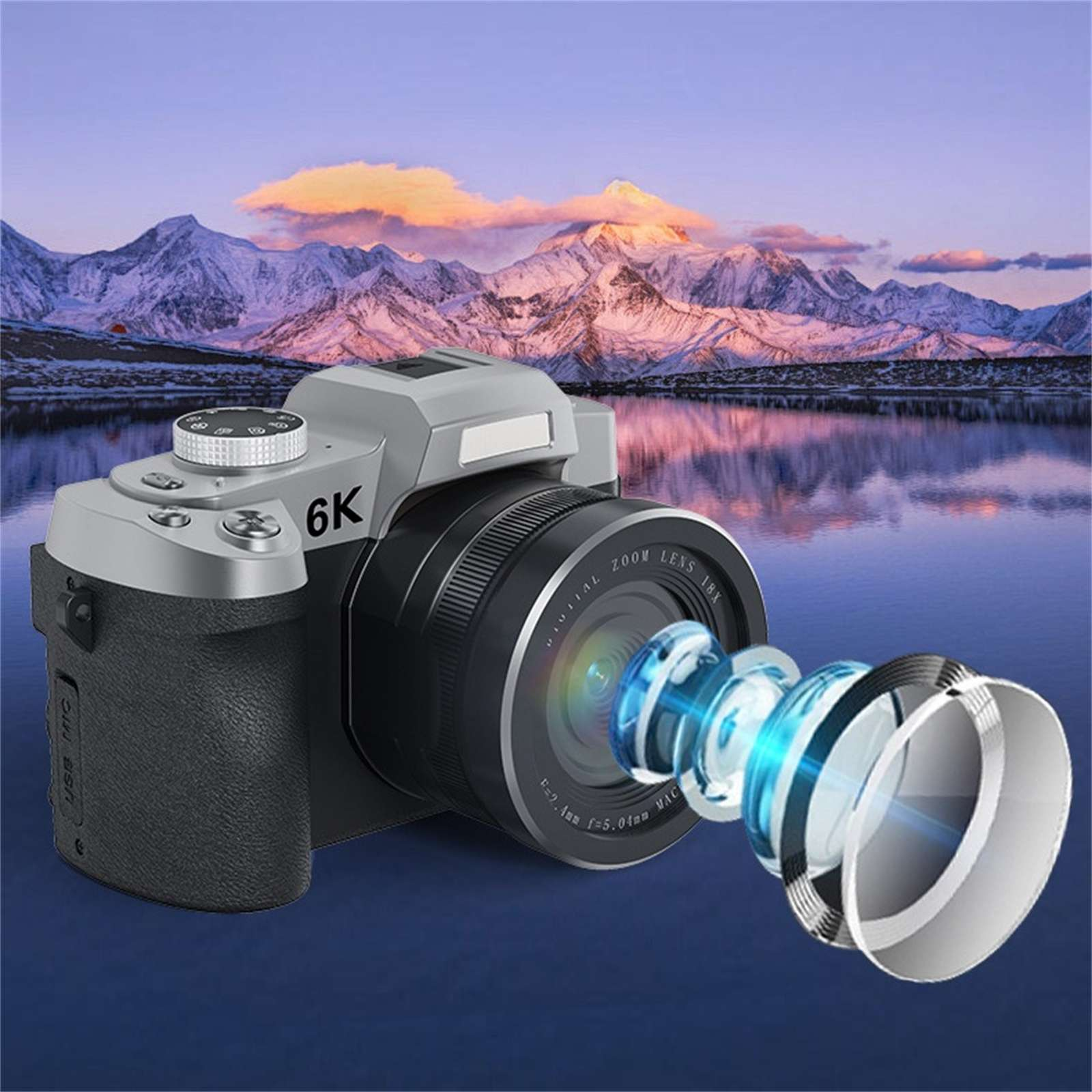 Eine silber-schwarze 6K-Kamera hat ein Objektiv, das sich nach außen erstreckt und blaue Highlights aufweist. Berge und Wasser im Hintergrund.