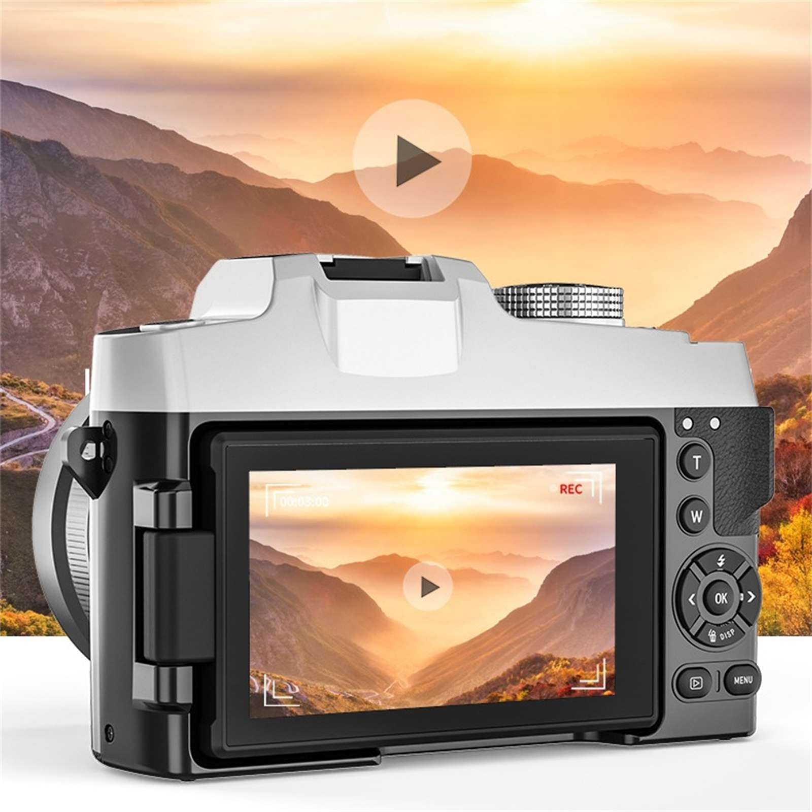 Eine Digitalkamera, die eine Berglandschaft auf ihrem Bildschirm anzeigt, mit einer Play-Button-Überlagerung. Der Hintergrund zeigt Berge bei Sonnenuntergang.