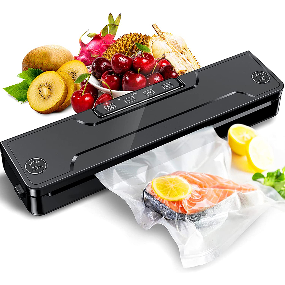 Ein schwarzes Vakuumiergerät mit Obst und einem Lachfilet in einer Tüte. Zu den Früchten gehören Kirschen, Kiwis und Drachenfrucht.