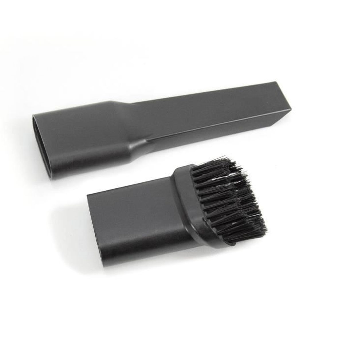 Dos accesorios negros de aspiradora sobre una superficie blanca. Uno es una boquilla para rincones, el otro tiene un cepillo.