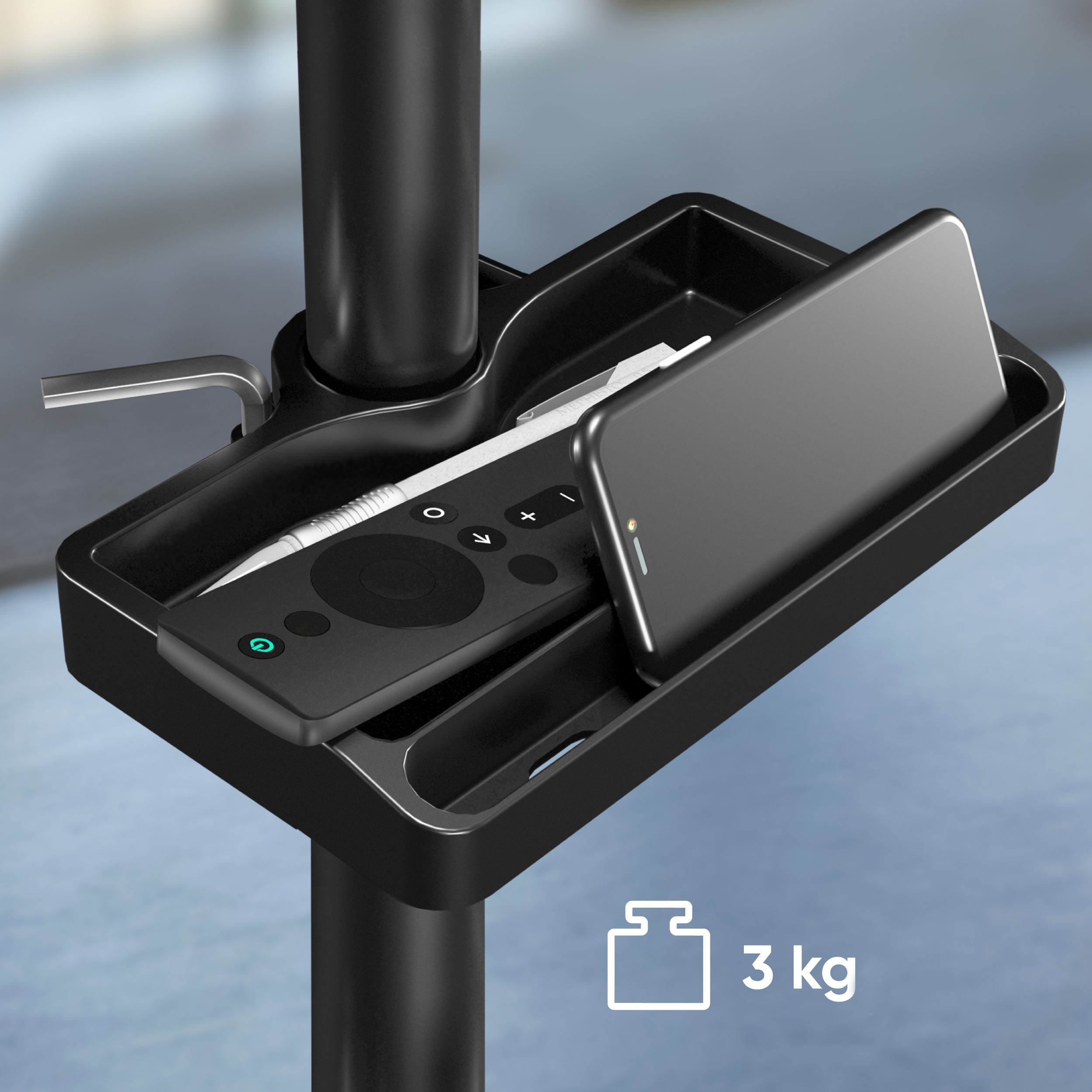 Un vassoio nero contiene telefono, telecomando e penna. Montato su palo nero, il peso è 3 kg.