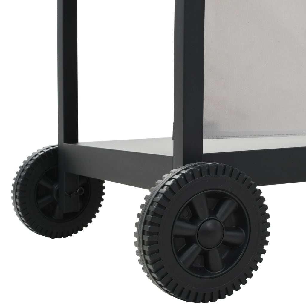 Czarny metalowy wózek z dwoma widocznymi kołami. Koła są czarne, ze szczegółowym bieżnikiem. Wózek ma jasną półkę.