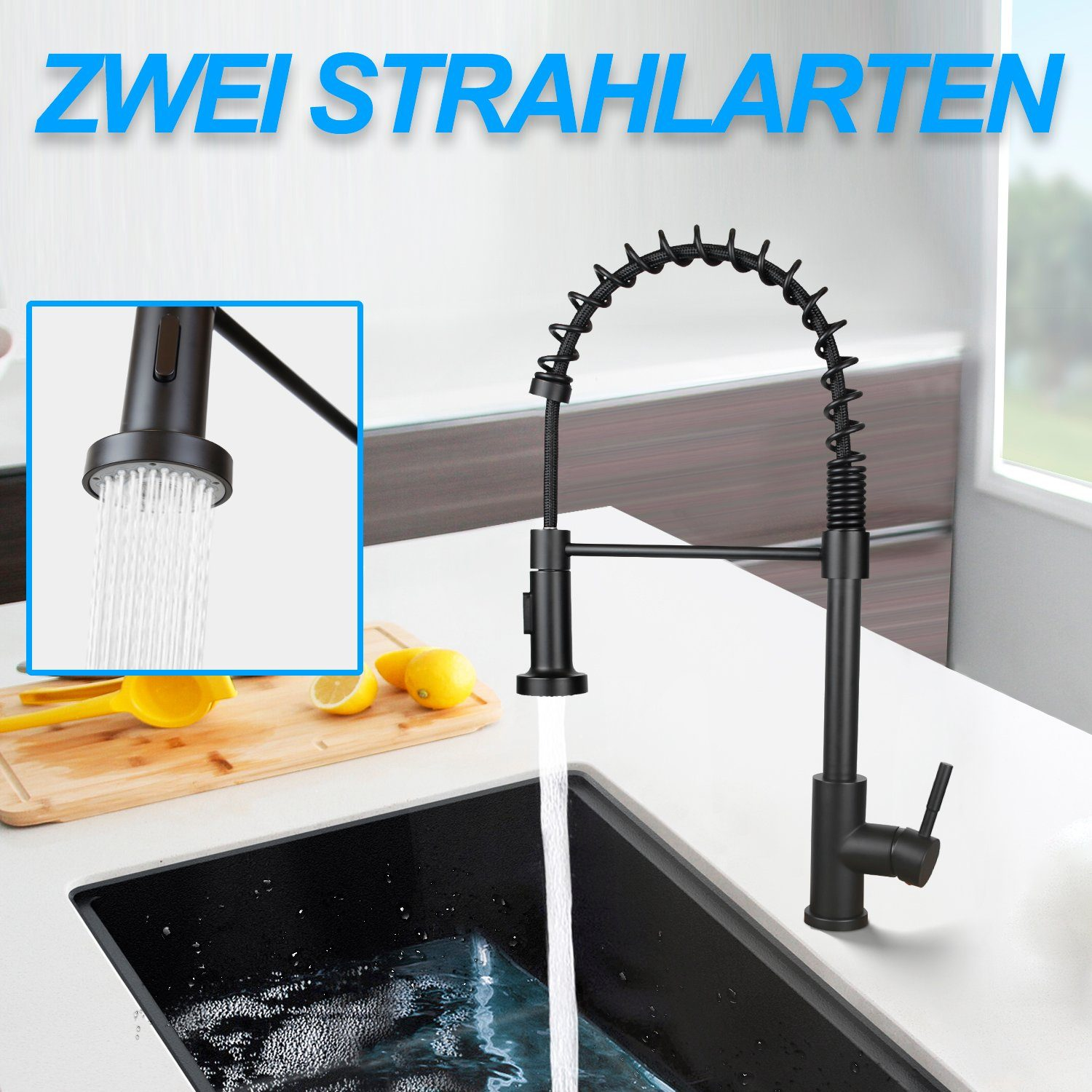 Czarna bateria kuchenna z wodą w czarnym zlewie. Cytryny i wyciskarka do cytrusów na desce do krojenia. Niebieski tekst: 'ZWEI STRAHLARTEN'.