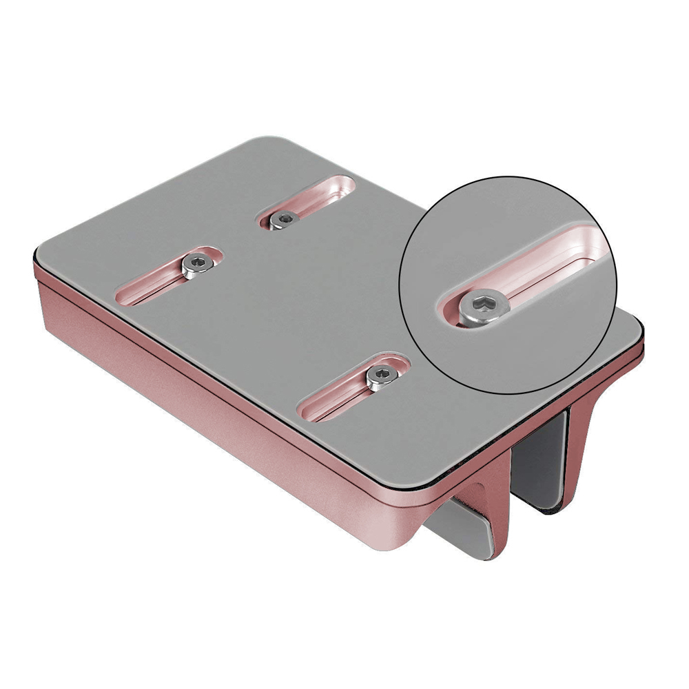 Un dispositivo metallico oro rosa e grigio, rettangolare con viti. Un inserto circolare mostra un dettaglio della vite.