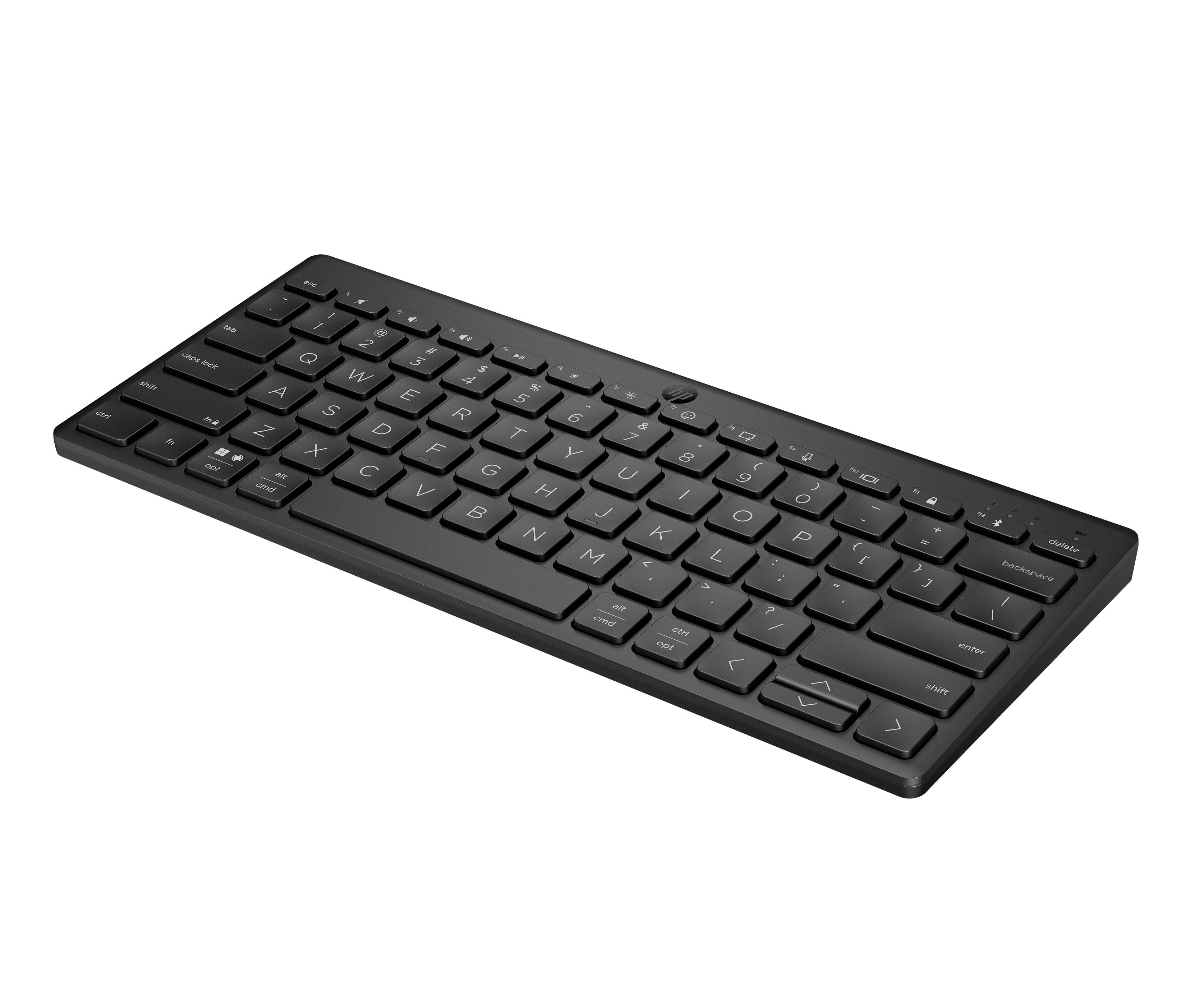 Un teclado inalámbrico negro con teclas. Las teclas tienen letras y símbolos blancos. El teclado está sobre una superficie blanca.