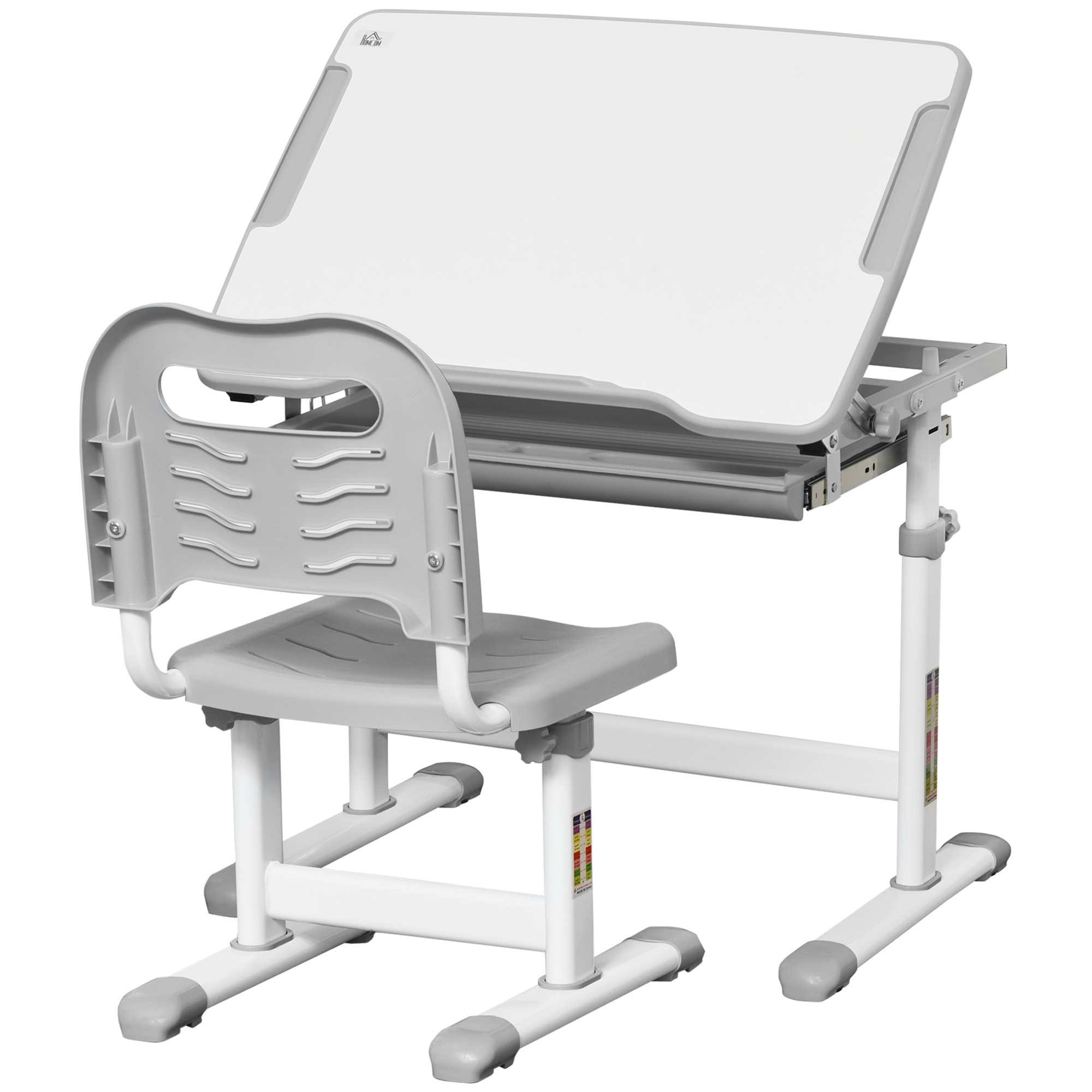 Un set scrivania e sedia per bambini regolabile bianco e grigio, isolato su bianco. Il piano è inclinato verso l'alto.