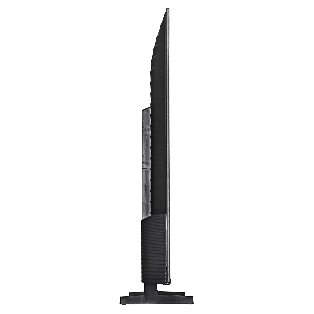 Widok z boku czarnego telewizora. Ekran jest cienki. Podstawa i tył telewizora są czarne.