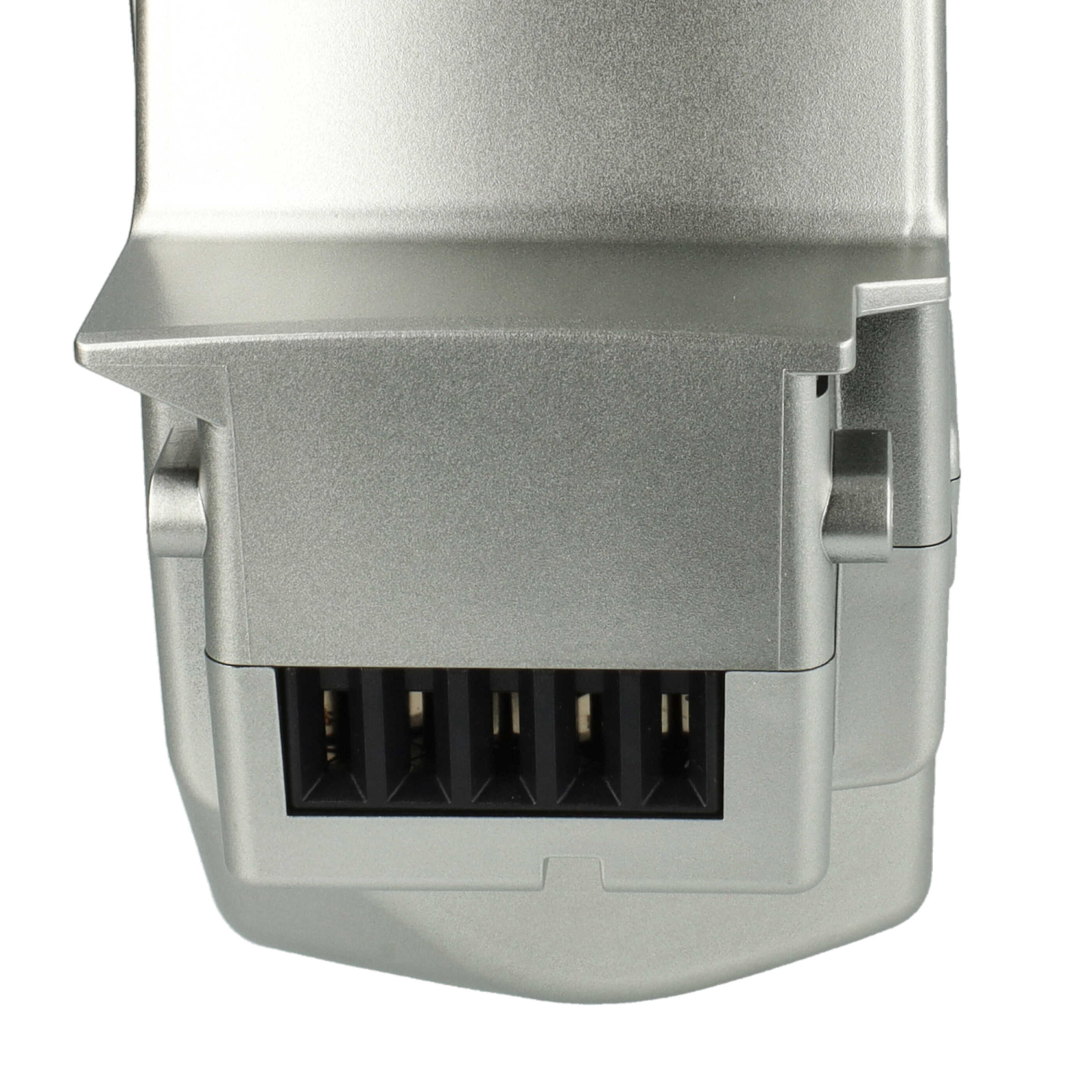 Nahaufnahme einer silberfarbenen elektrischen Komponente mit schwarzen Steckern und strukturierter Oberfläche.