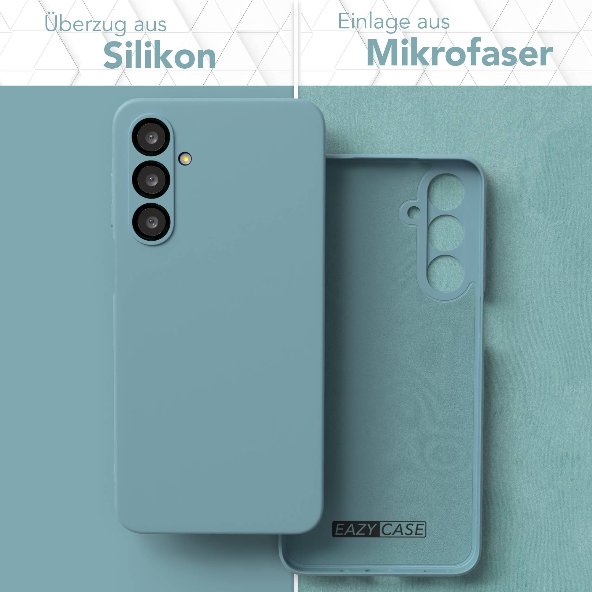Eine tealfarbene Handyhülle mit Silikonaußenseite und Mikrofaserinnenseite, die die Kamera des Telefons zeigt. Der Markenname ist sichtbar.