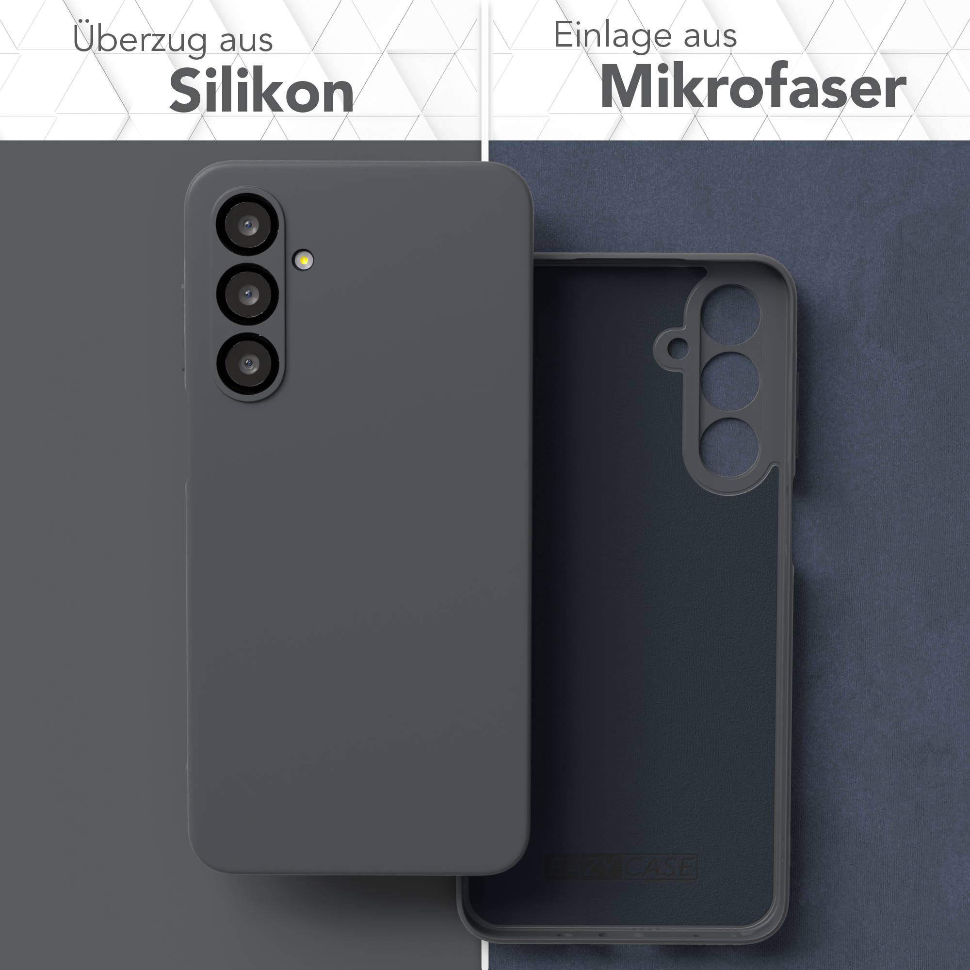Graue Handyhülle aus Silikon, geöffnet, um Mikrofaser innen zu zeigen. Deutsche Beschriftungen beschreiben die Materialien.