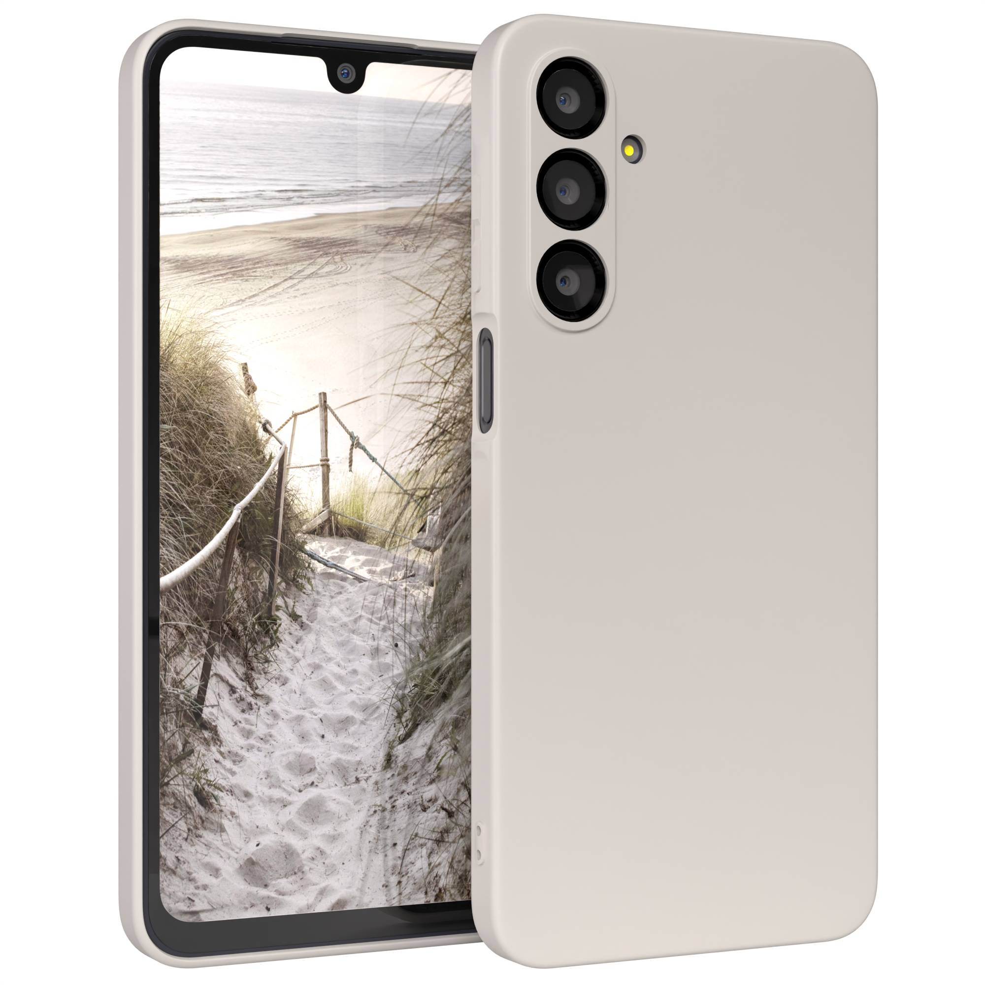 Smartphone mit Strandmotiv. Das Telefon hat eine beige Hülle. Strandweg, Sand, Meer und Himmel sind sichtbar.