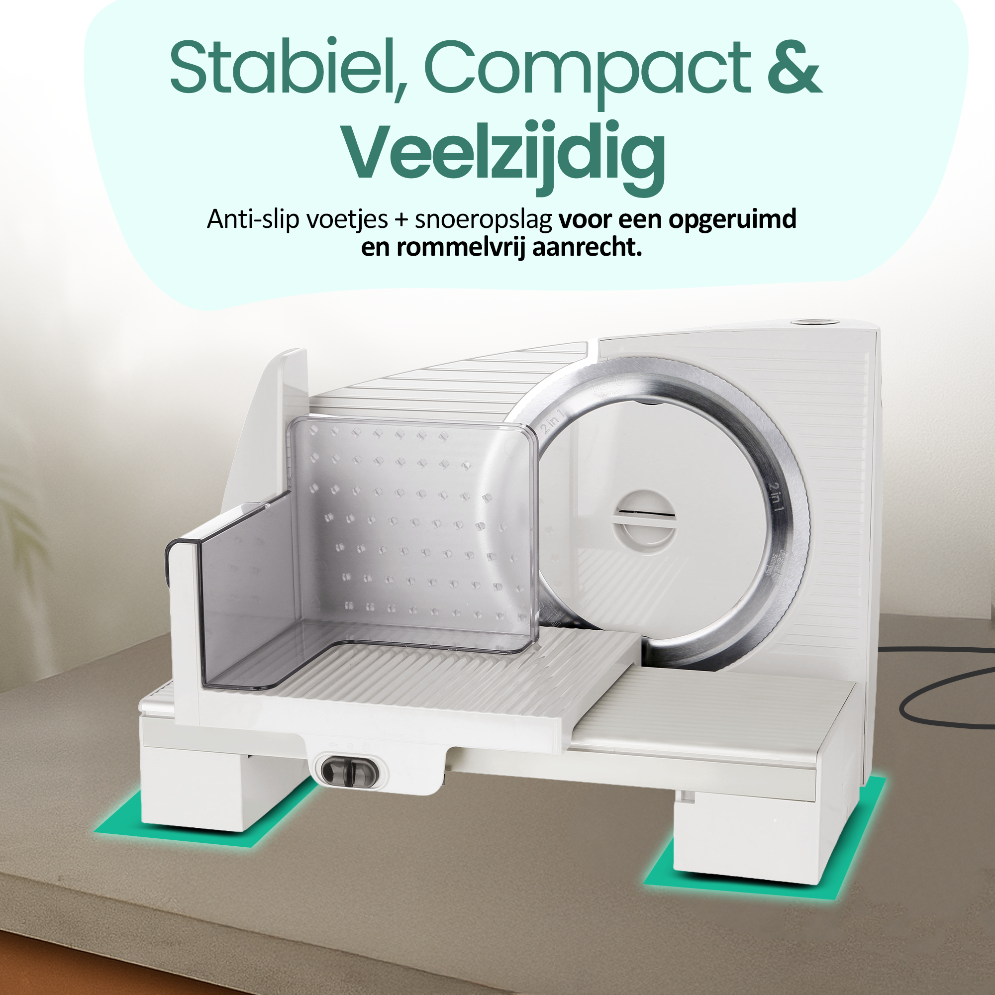 White food slicer with a large blade. It has a clear plastic food guard and sits on a countertop.
