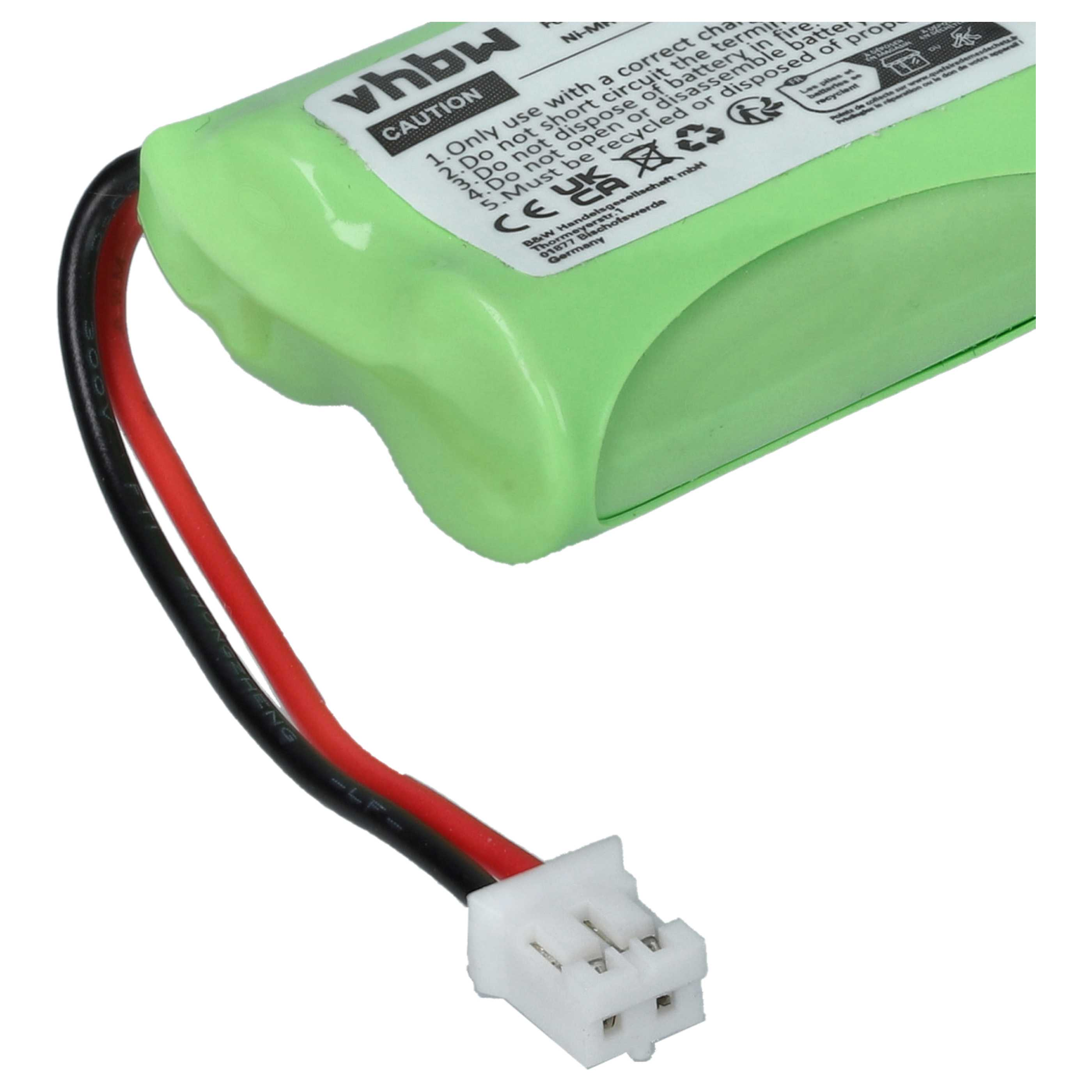 Eine grüne Batterie mit einem schwarzen und roten Draht und einem weißen Stecker.