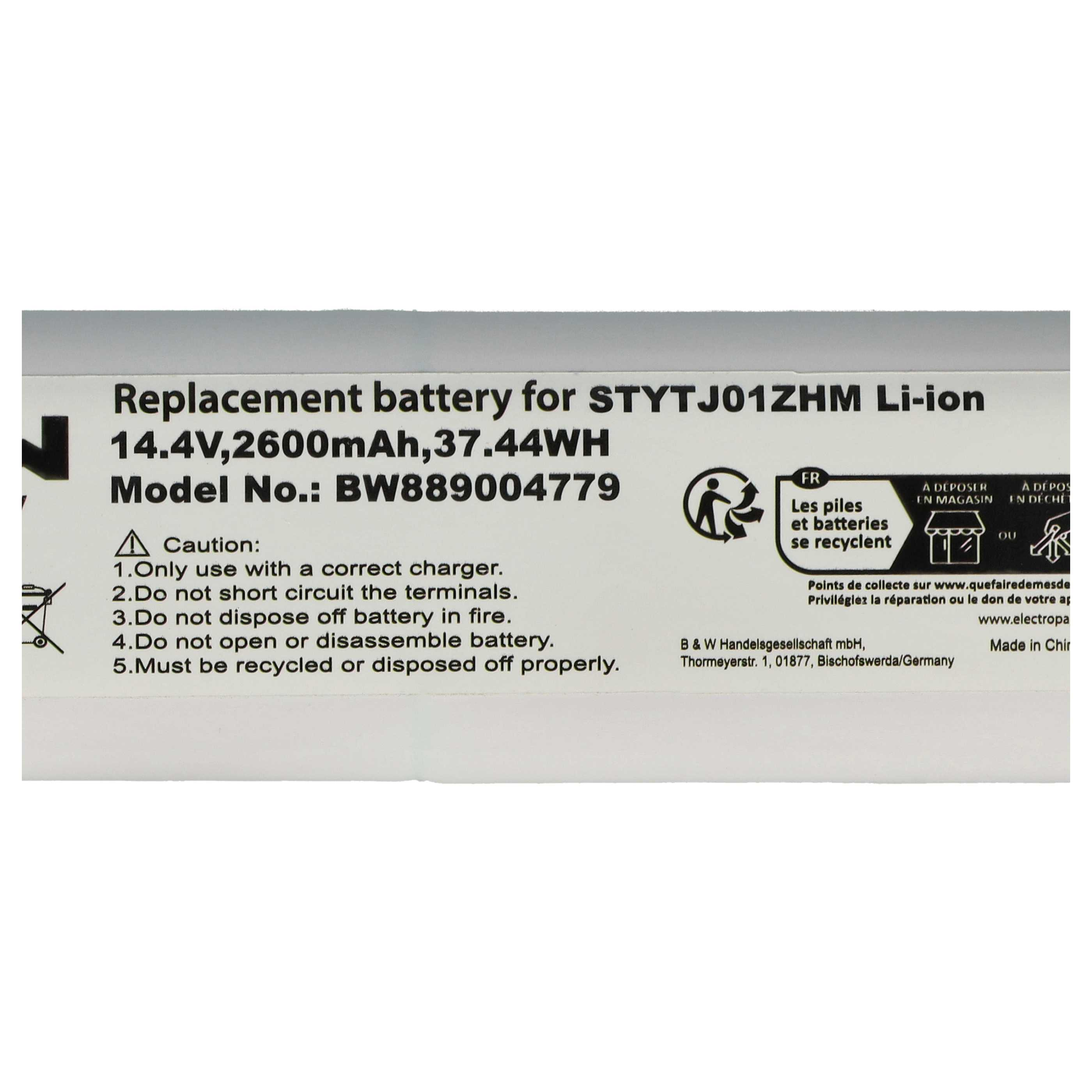 Ein Batterielabel mit Warnhinweisen und Spezifikationen wird angezeigt. Es enthält Spannung, Modellnummer und Recyclinganweisungen.