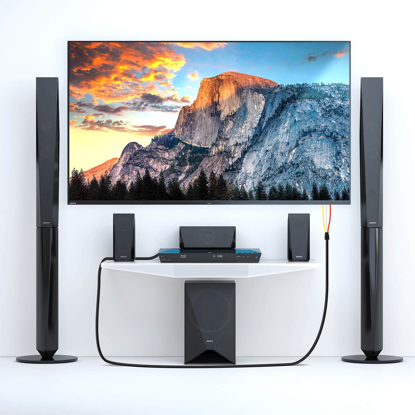 Ein Heimkino-Setup mit einem Fernseher, der eine Berglandschaft zeigt, Lautsprechern und einem Blu-ray-Player.