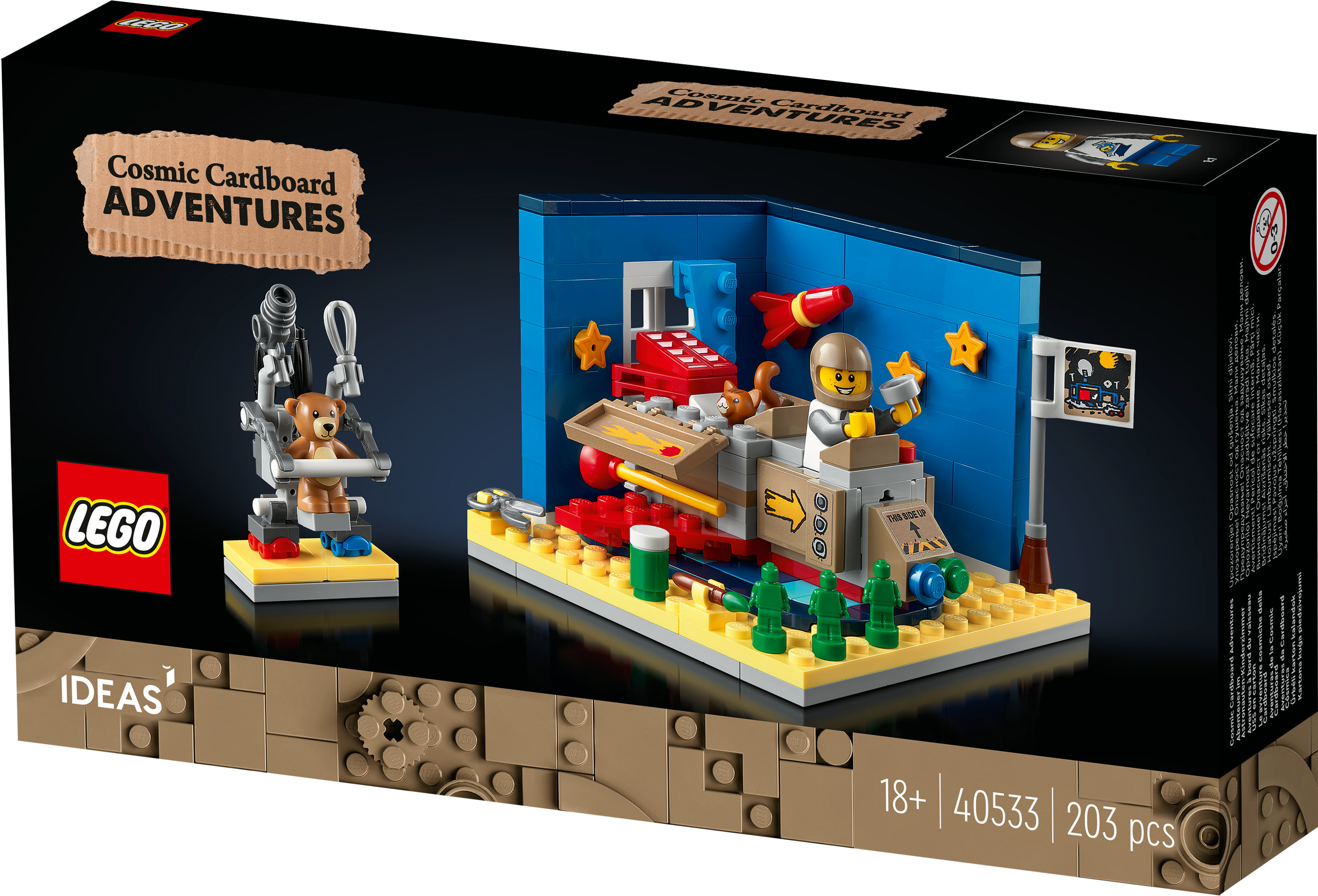 Lego set kutusu. Set, astronotlar, yıldızlar ve bir sandalyede bir oyuncak ayı ile karton bir uzay gemisi tasvir ediyor.