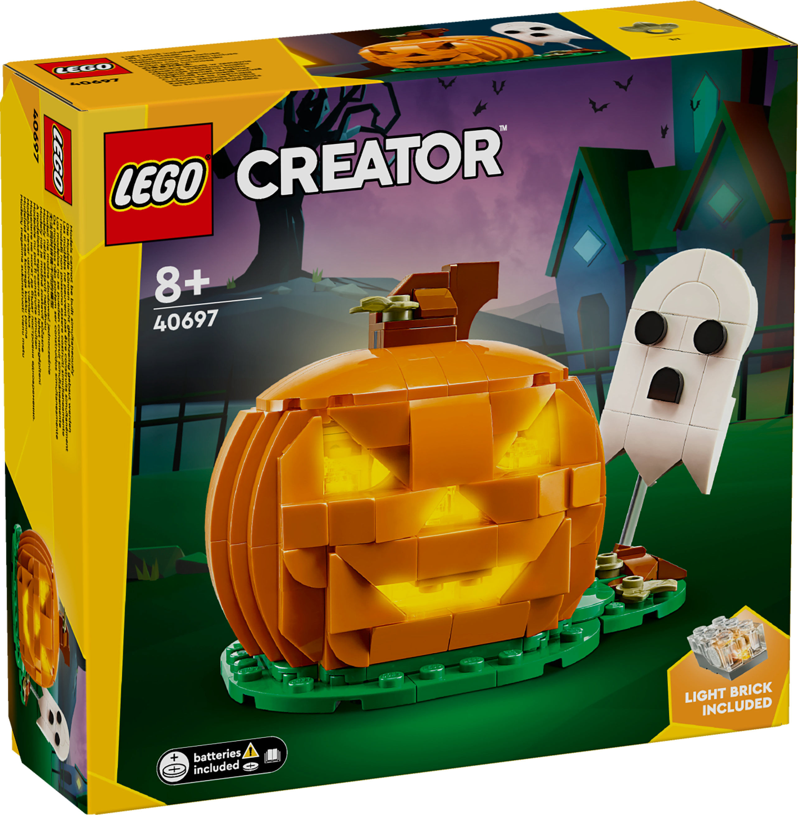 Scatola del set LEGO Creator con zucca, fantasma e casa. La zucca arancione si illumina. Base verde e cielo viola scuro.