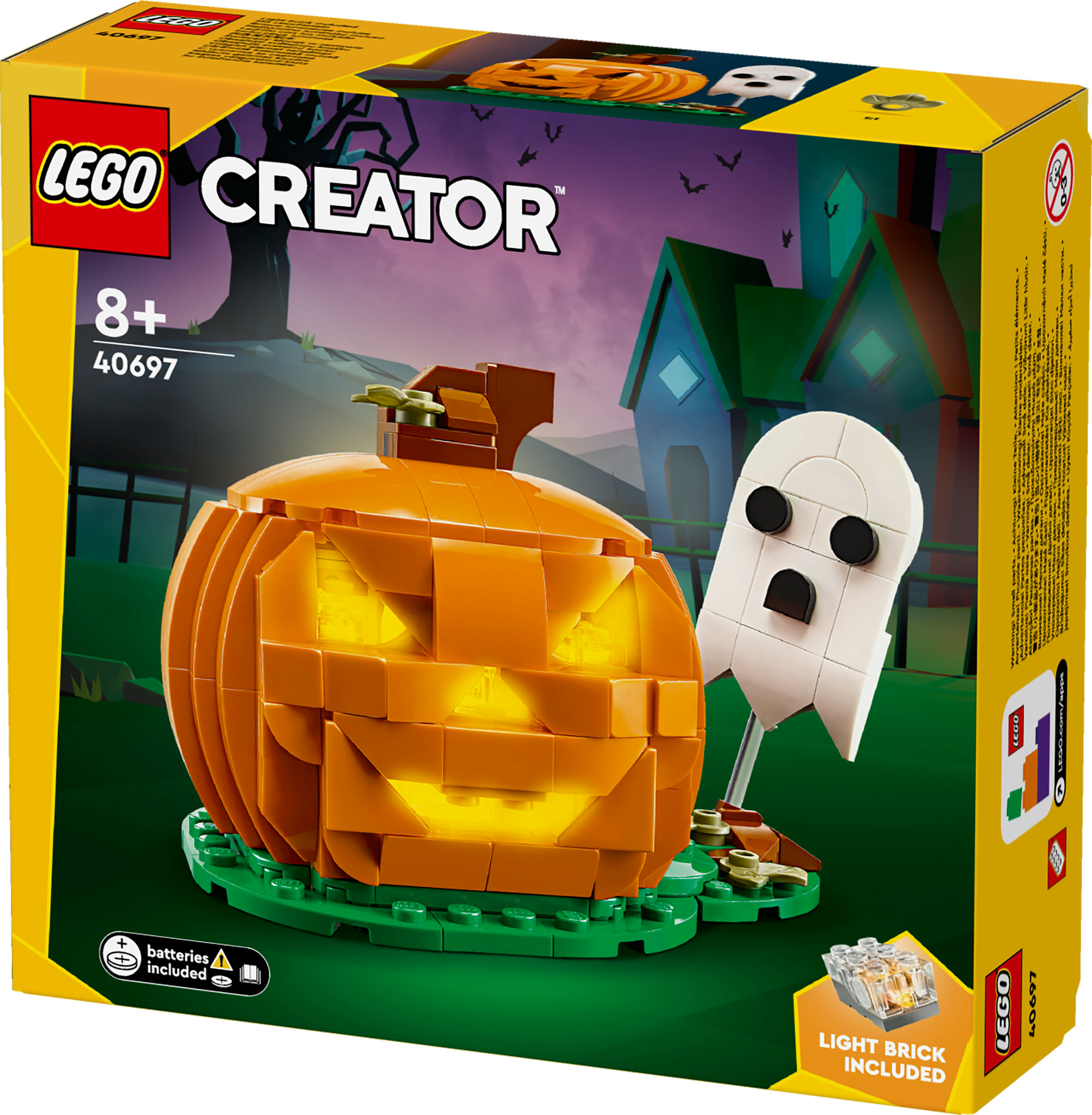 Set LEGO Creator di Halloween. Include una zucca luminosa e un fantasma su una base verde. La scatola mostra una scena spettrale.
