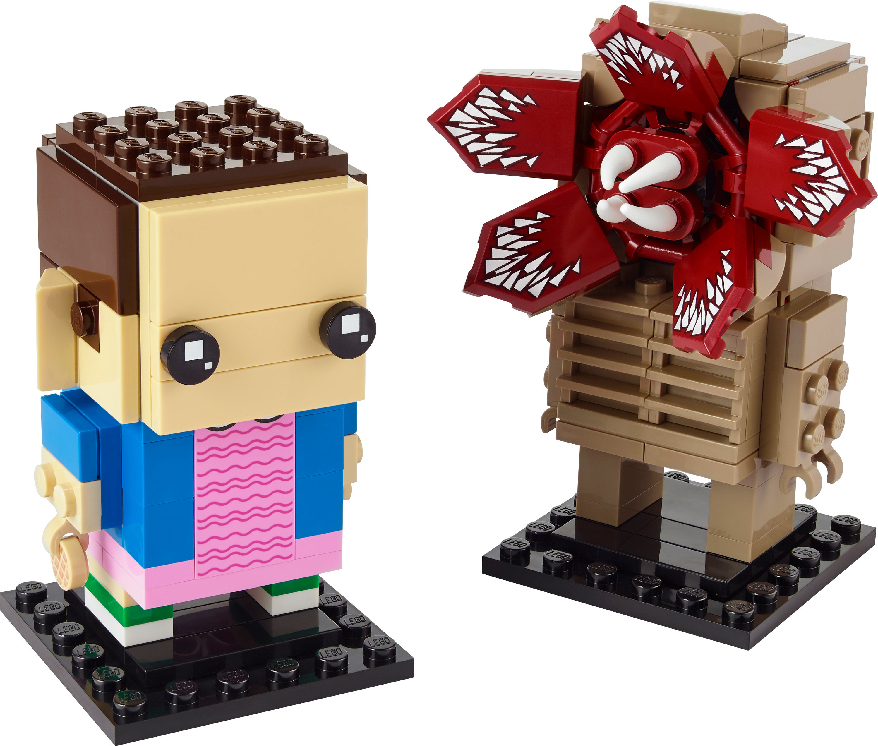 Twee LEGO-figuren: Elf en een Demogorgon. Elf heeft bruin haar, zwarte ogen, een blauwe top en een roze jurk. De Demogorgon heeft een rode kop.