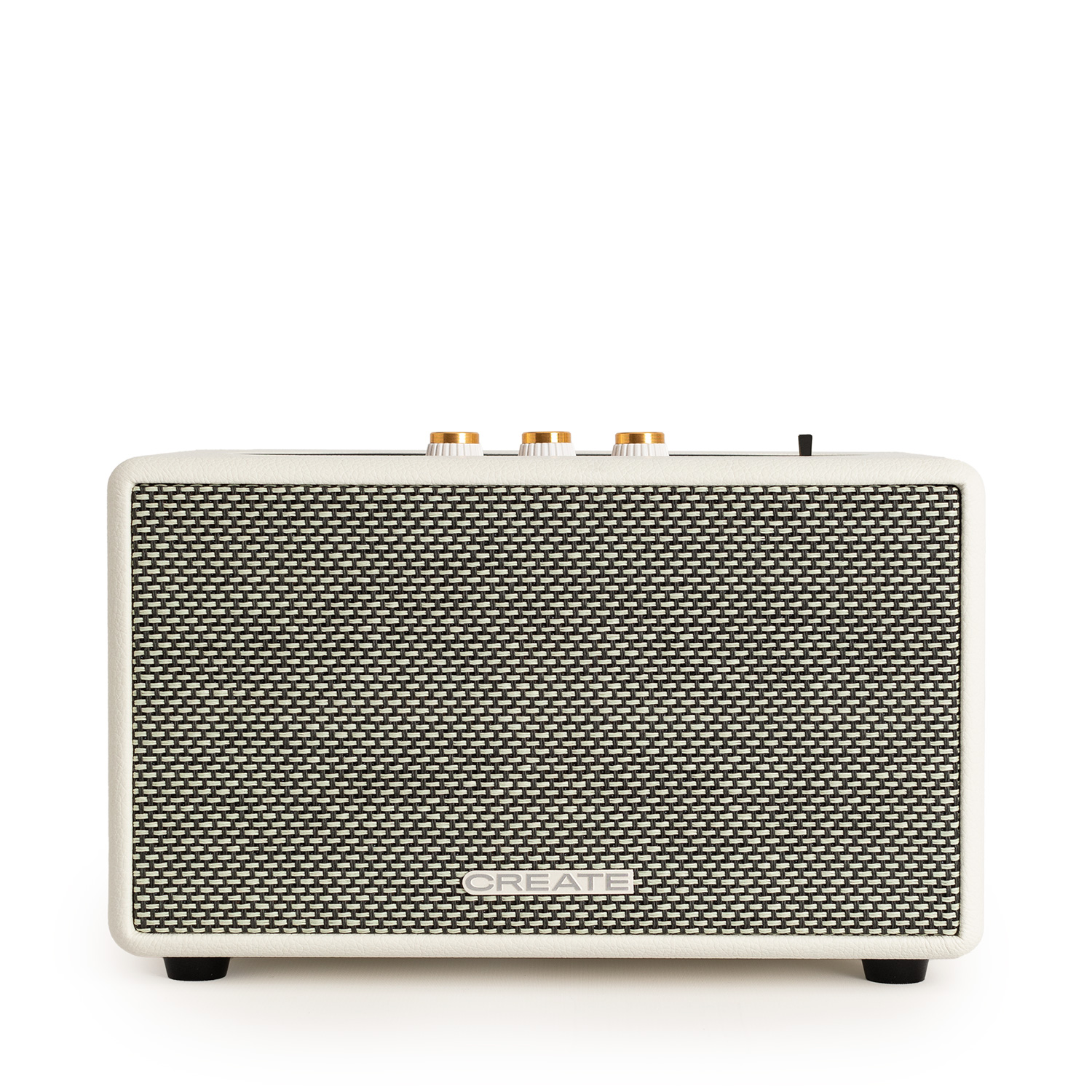 Un altavoz rectangular con frente texturizado en blanco y negro, marco crema y perillas doradas. Se apoya en cuatro patas negras.