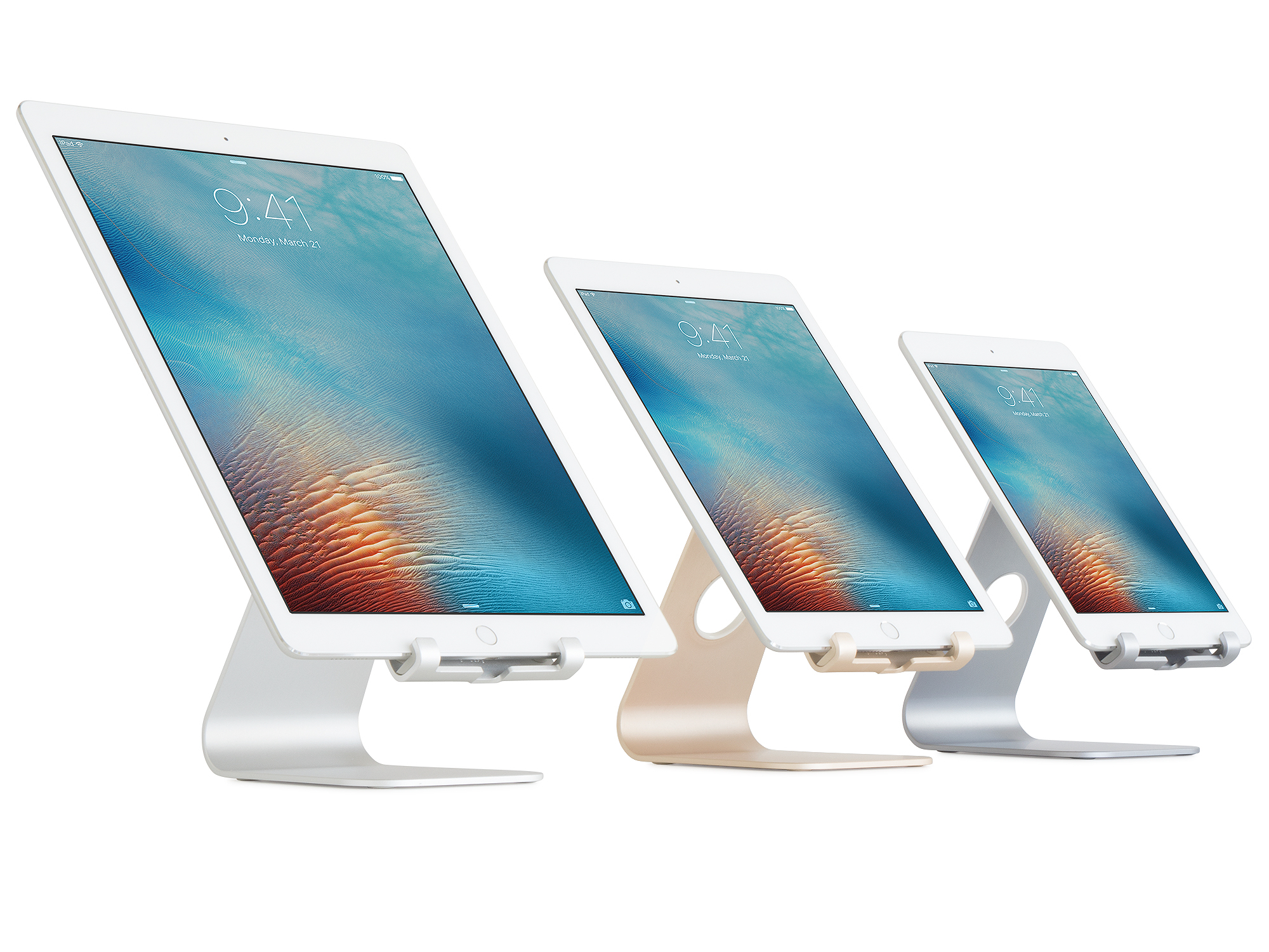 Three tablets on stands. The screens show the time as 9:41 AM, Monday, March 21. The stands are silver, gold, and gray.