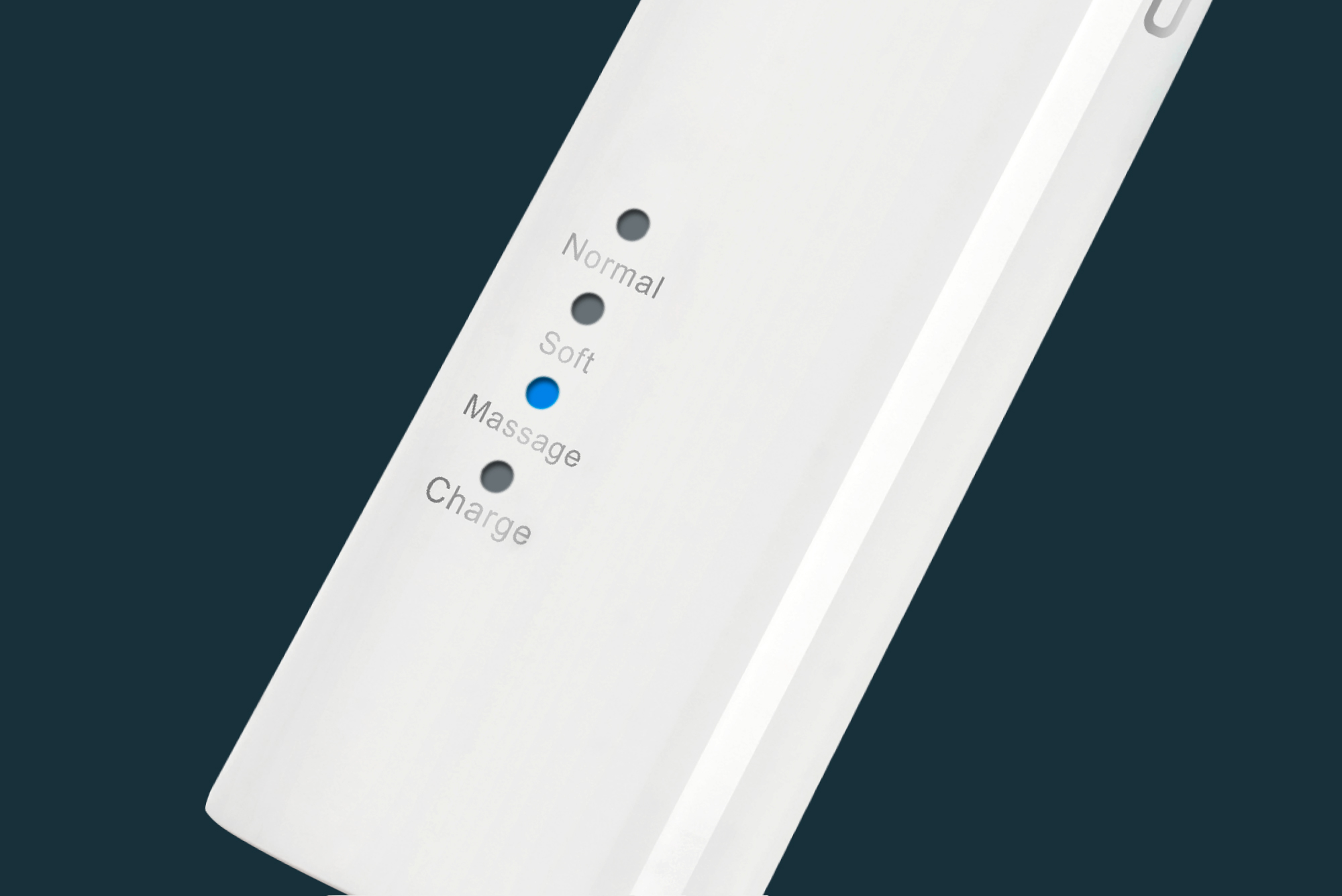 Białe urządzenie z podświetlanymi wskaźnikami: Normalny, Miękki, Masaż (niebieski) i Ładowanie. Ciemnozielono-niebieskie tło.