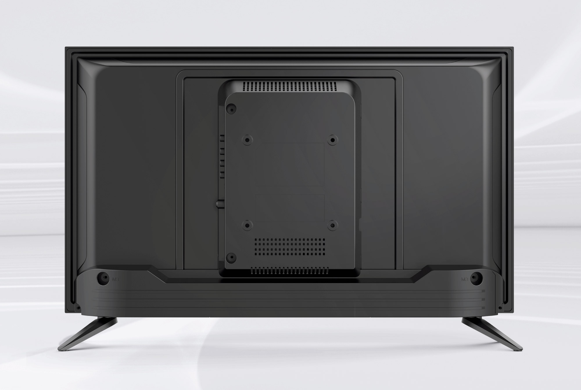 Widok z tyłu czarnego telewizora. Ma prostokątny kształt z centralnym panelem, otworami wentylacyjnymi i dwiema nóżkami.