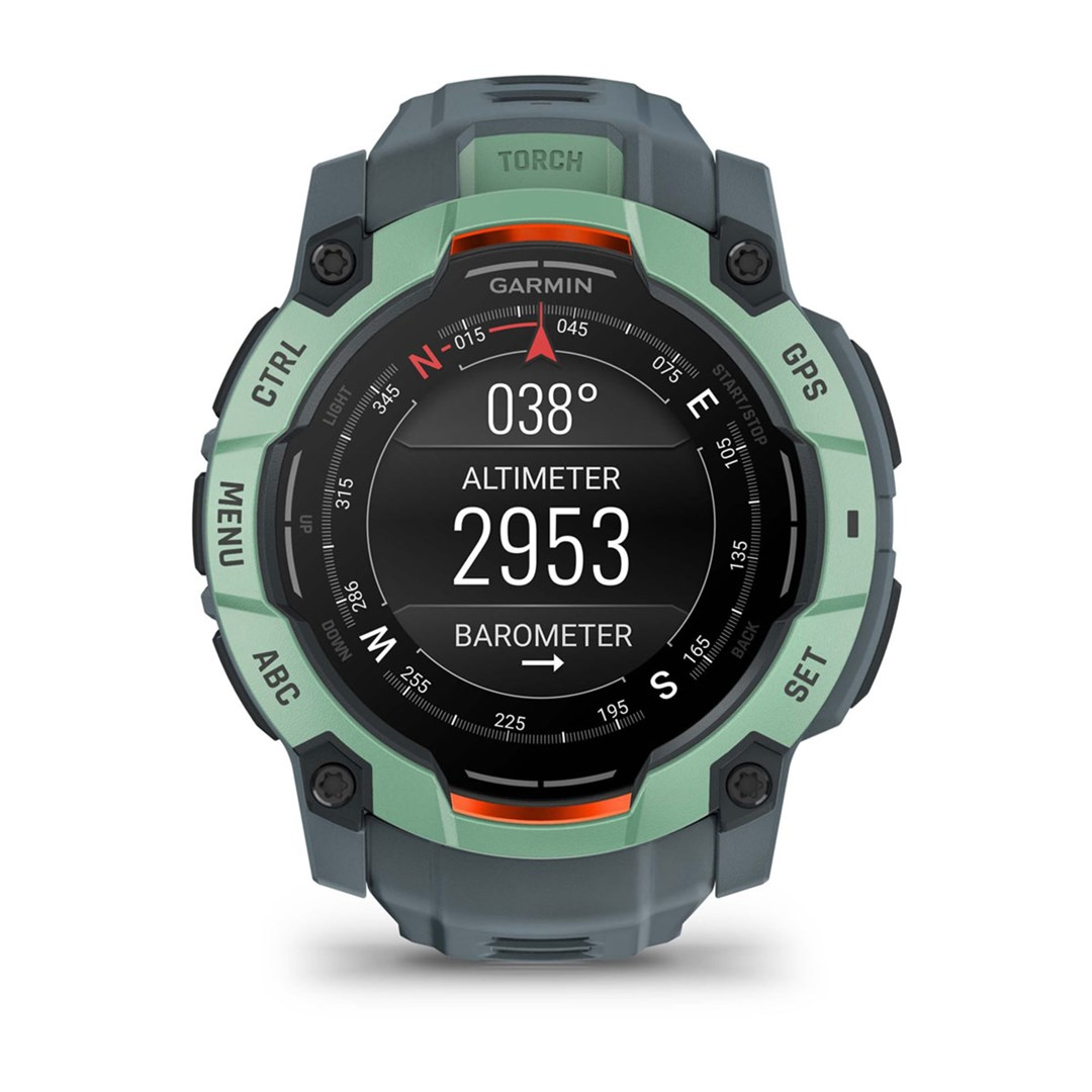 Zegarek Garmin z cyfrowym wyświetlaczem pokazującym wysokość, barometr i kompas. Zegarek jest zielony i szary.
