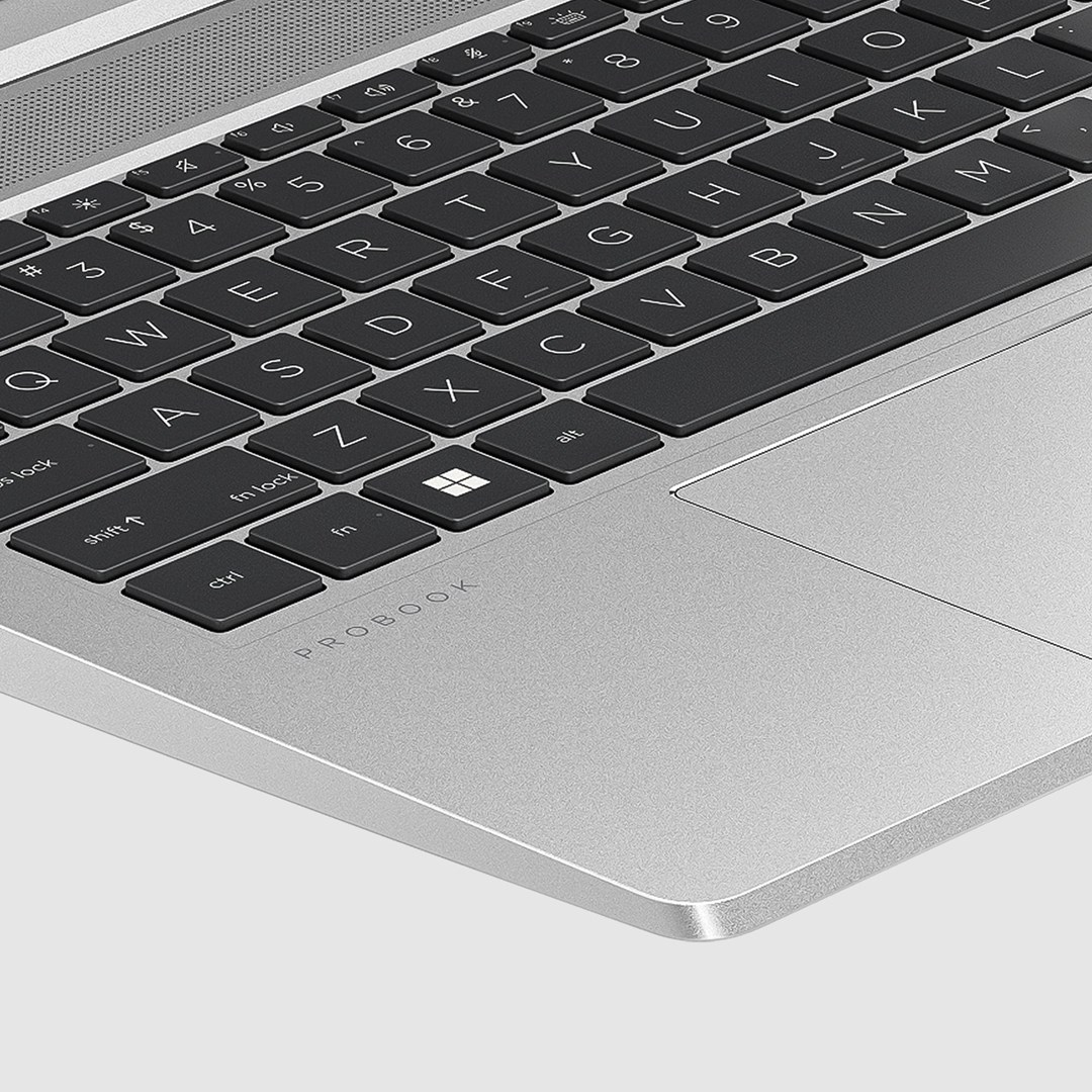 Zbliżenie klawiatury laptopa. Czarne klawisze z białymi literami i symbolami. Srebrna powierzchnia laptopa z napisem 'PROBOOK'.