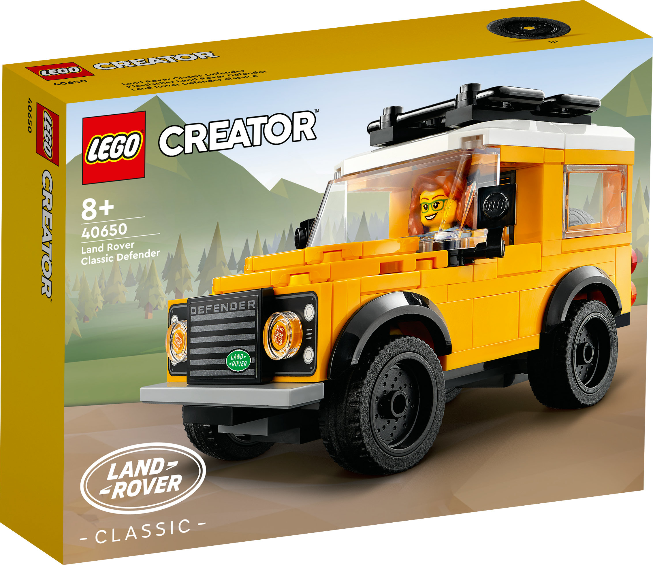 Bir Lego Creator Land Rover Defender seti. Kutu, içinde bir minifigür bulunan, monte edilmiş sarı ve siyah oyuncak arabayı gösteriyor.