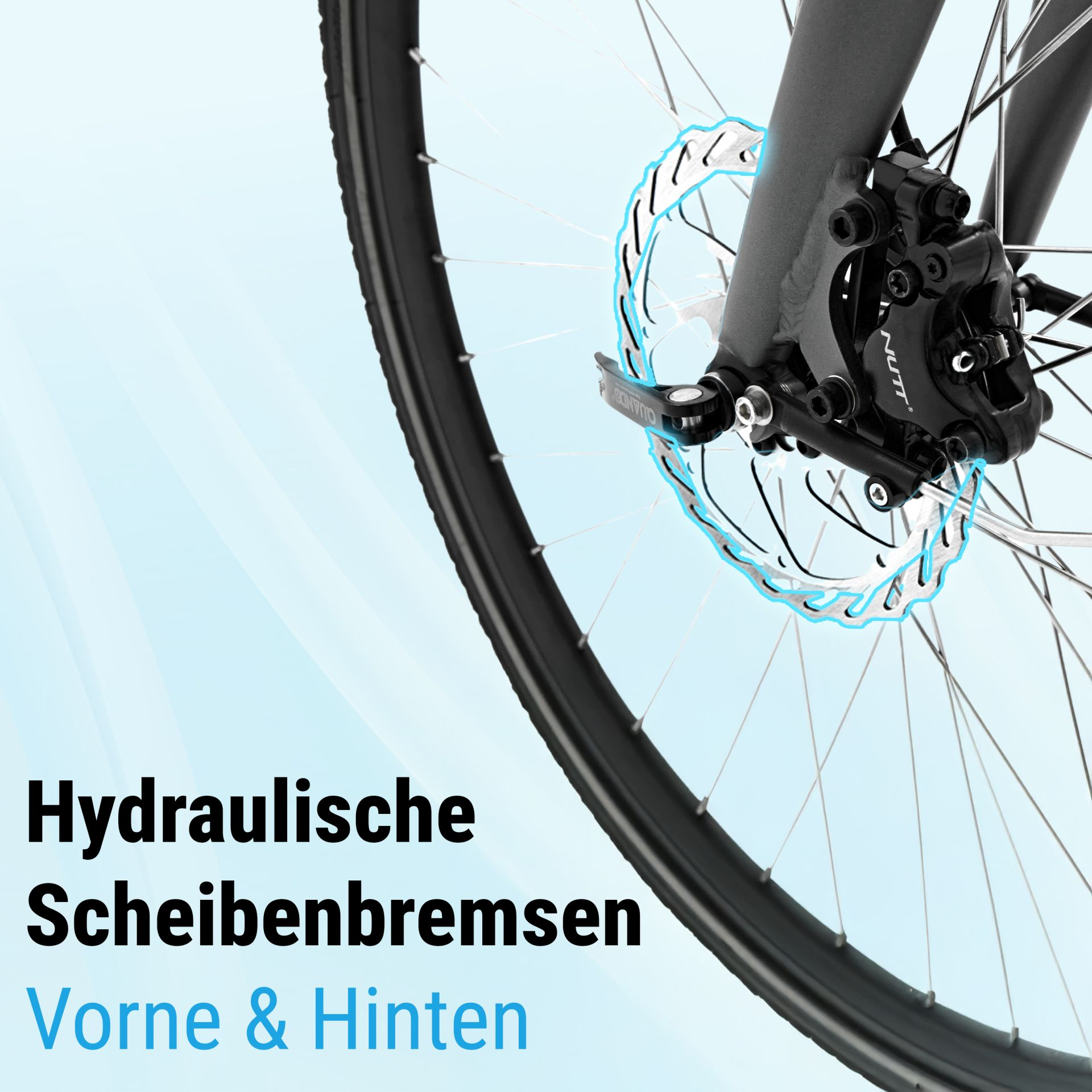 Nahaufnahme eines Fahrradrads mit hydraulischer Scheibenbremse. Die Bremse ist schwarz, die Scheibe silbern mit blauen Akzenten.