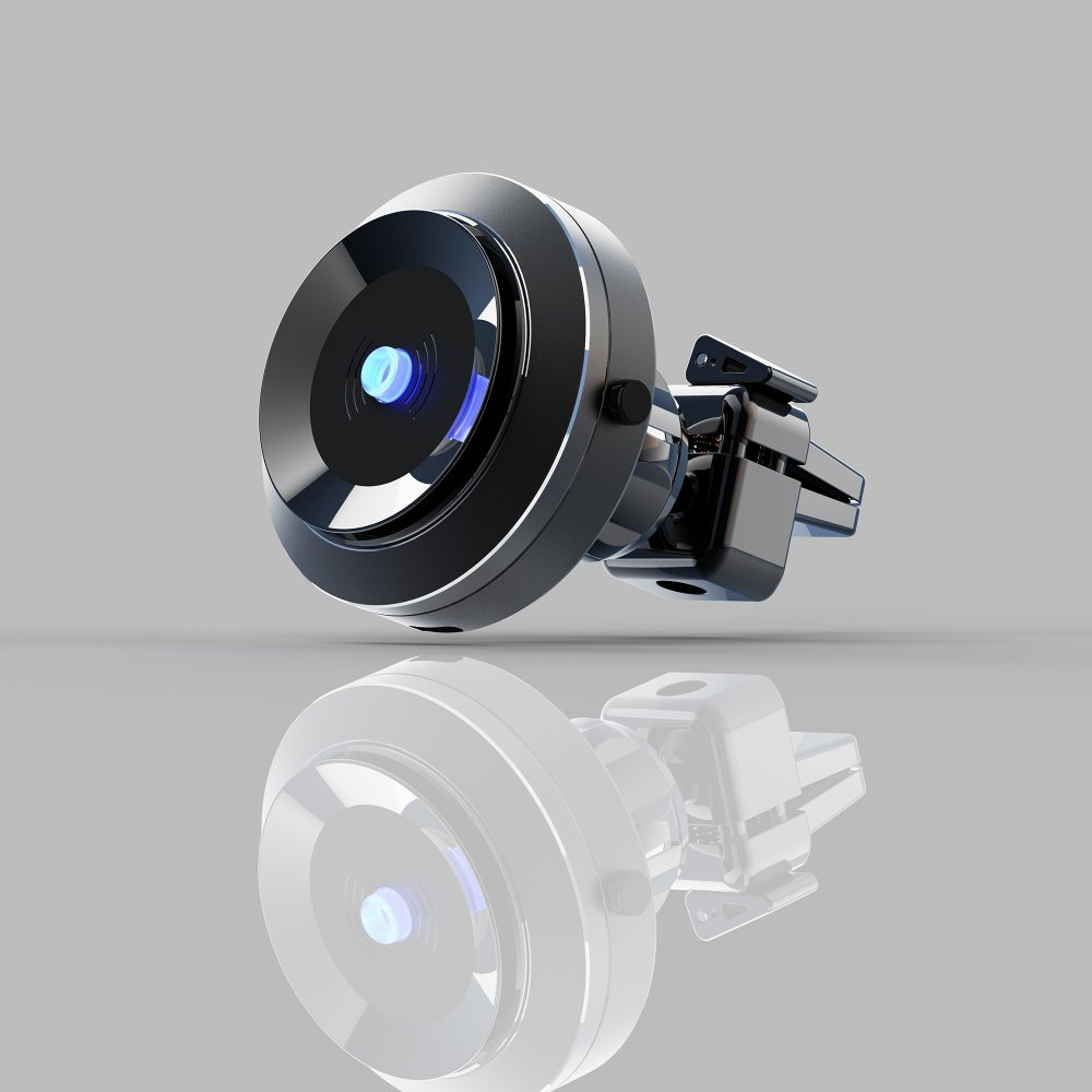 Un accessorio per auto nero e argento con una luce blu, riflesso su una superficie grigia. L'accessorio ha un design circolare.