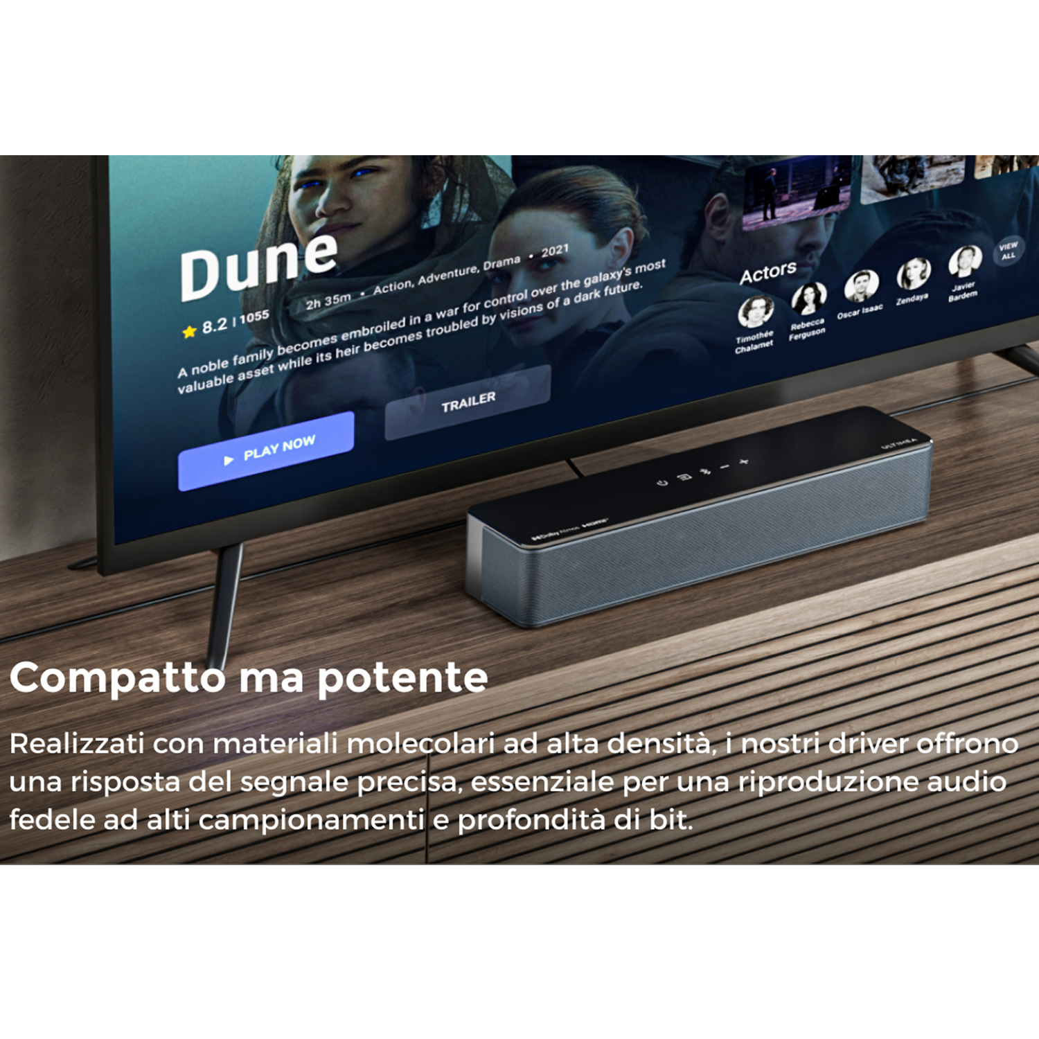 Un televisore mostra il film "Dune". Sotto c'è una soundbar. La scena è ambientata su un mobile di legno.