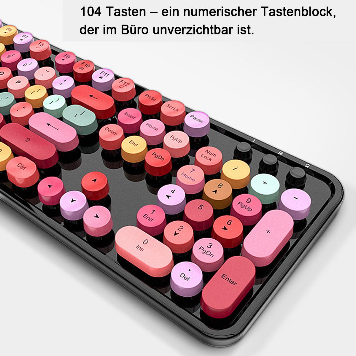 Un teclado colorido con teclas redondas. Las teclas son de varios colores: rosa, rojo, amarillo y verde. El teclado tiene un marco negro.