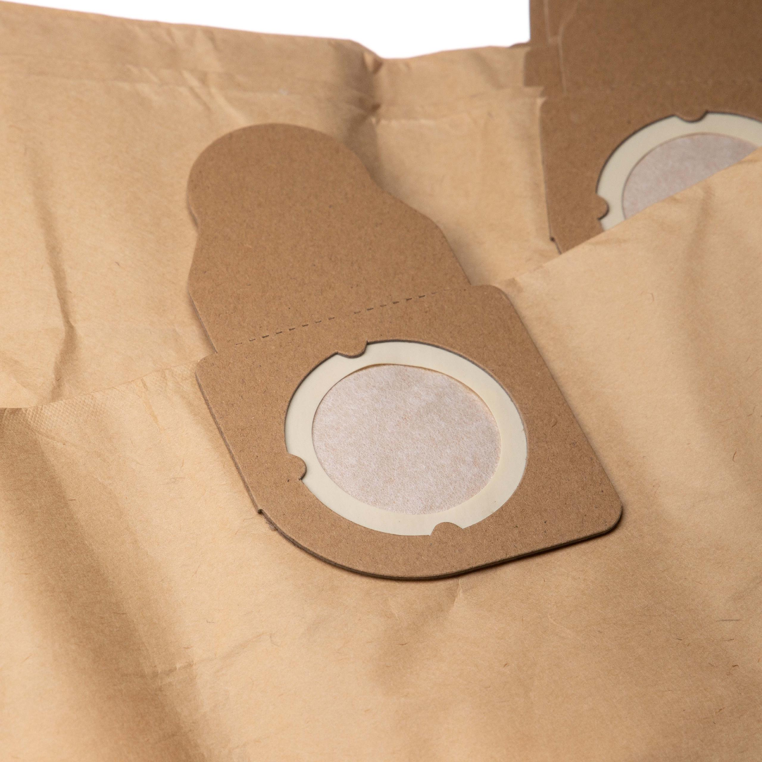 Nahaufnahme von Staubsaugerbeuteln. Braune Papiertüten mit kreisförmigen Filteröffnungen. Hintergrund ist weiß.