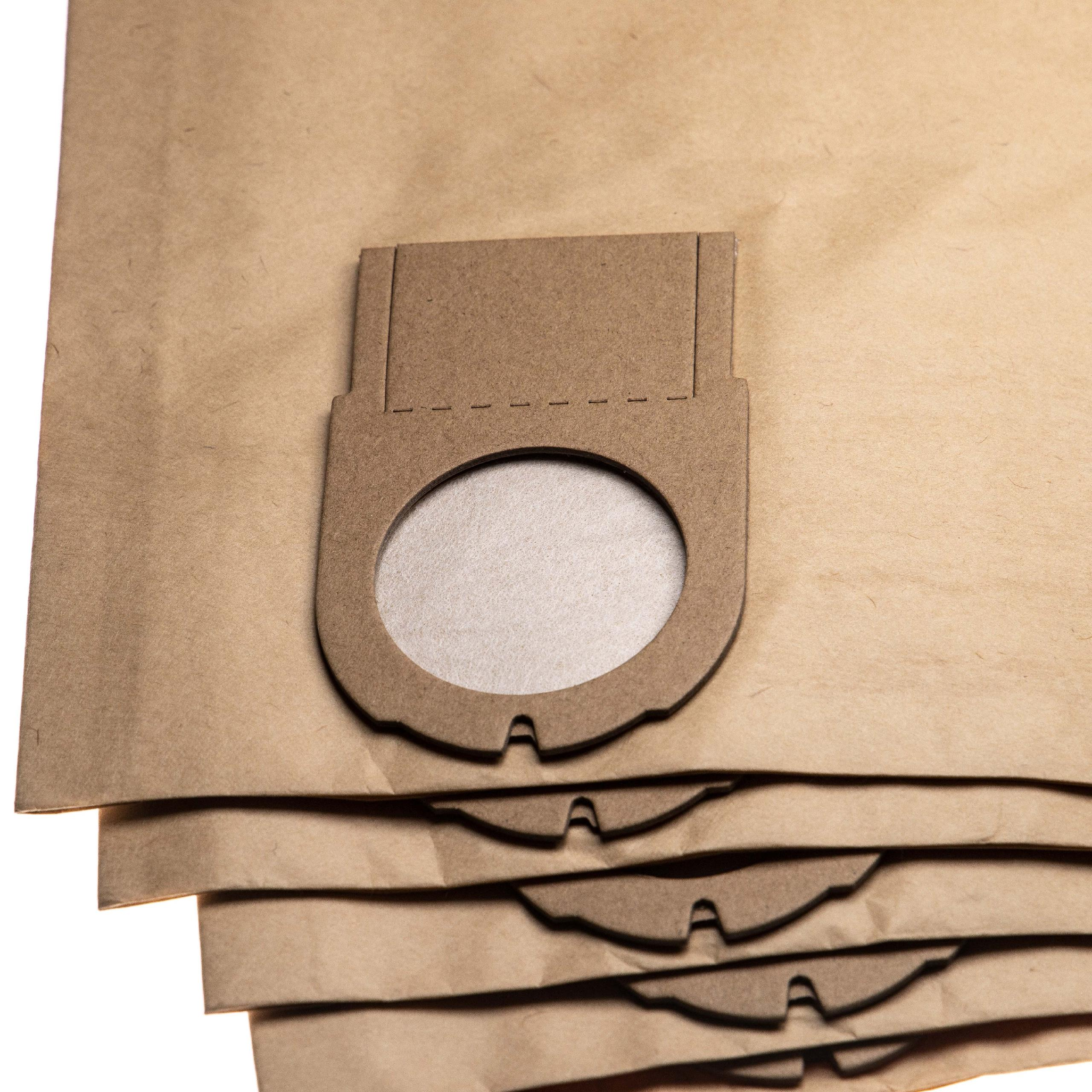 Nahaufnahme von Staubsaugerbeuteln. Braune Papiertüten sind gestapelt. Die obere Tüte hat eine Kartonöffnung mit rundem Loch.
