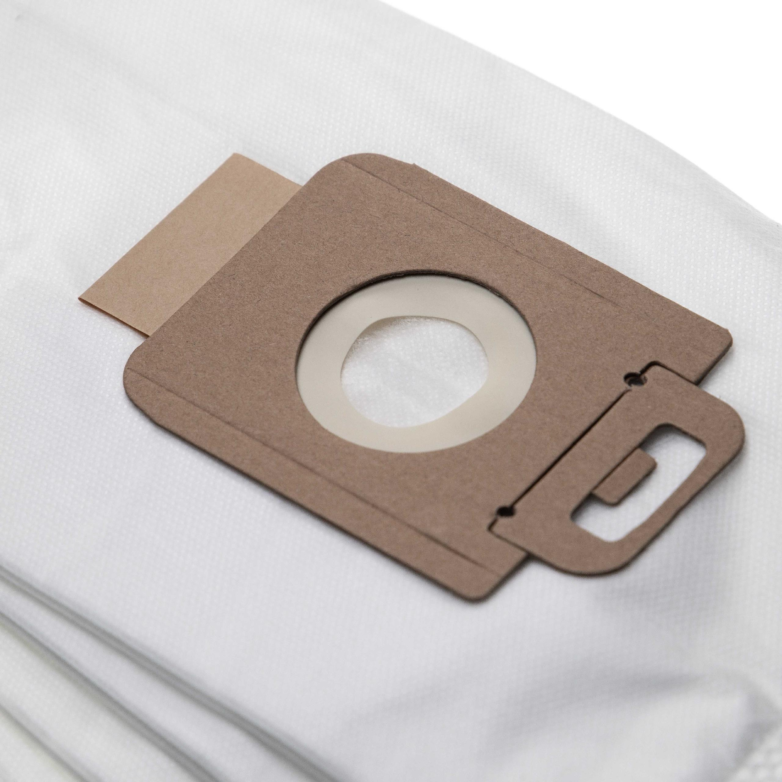 Nahaufnahme der Kartonöffnung eines Staubsaugerbeutels und des weißen Filtermaterials. Die Öffnung ist braun mit einem Loch.