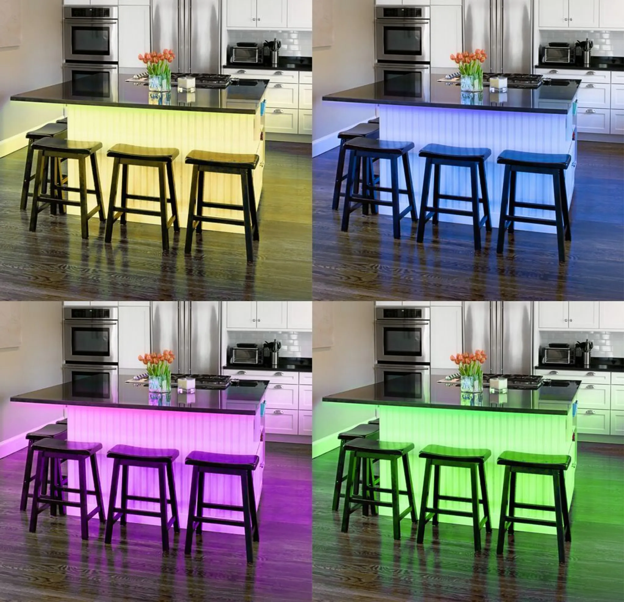 Kücheninsel mit schwarzer Arbeitsplatte und Hockern. LED-Leuchten wechseln die Farbe. Küchengeräte und weiße Schränke im Hintergrund.