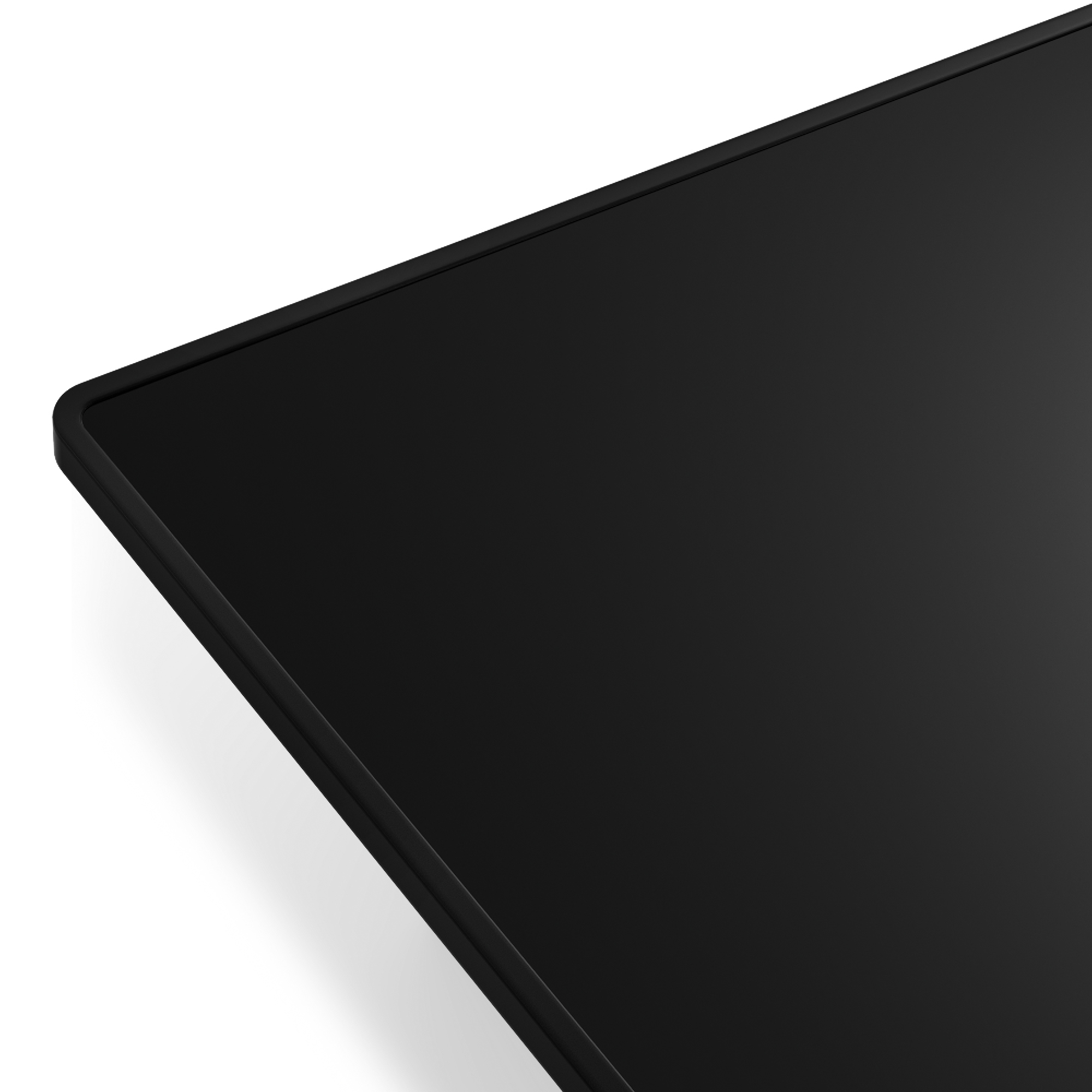 Objeto rectangular negro con esquinas redondeadas, diagonal sobre fondo blanco. Las sombras sugieren profundidad.